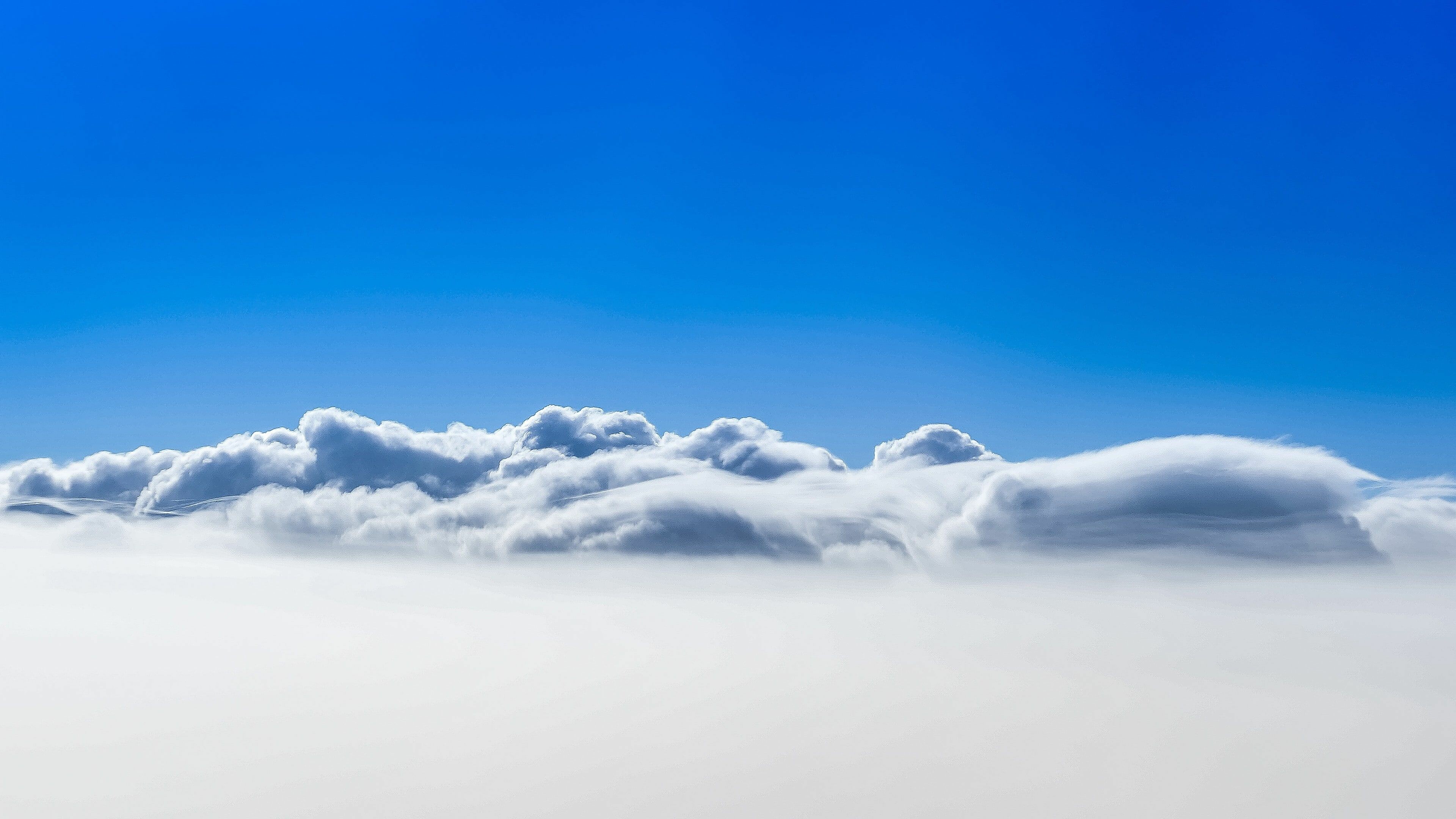 Clouds: Blue sky, Fog is commonly considered a surface-based cloud layer. 3840x2160 4K Background.