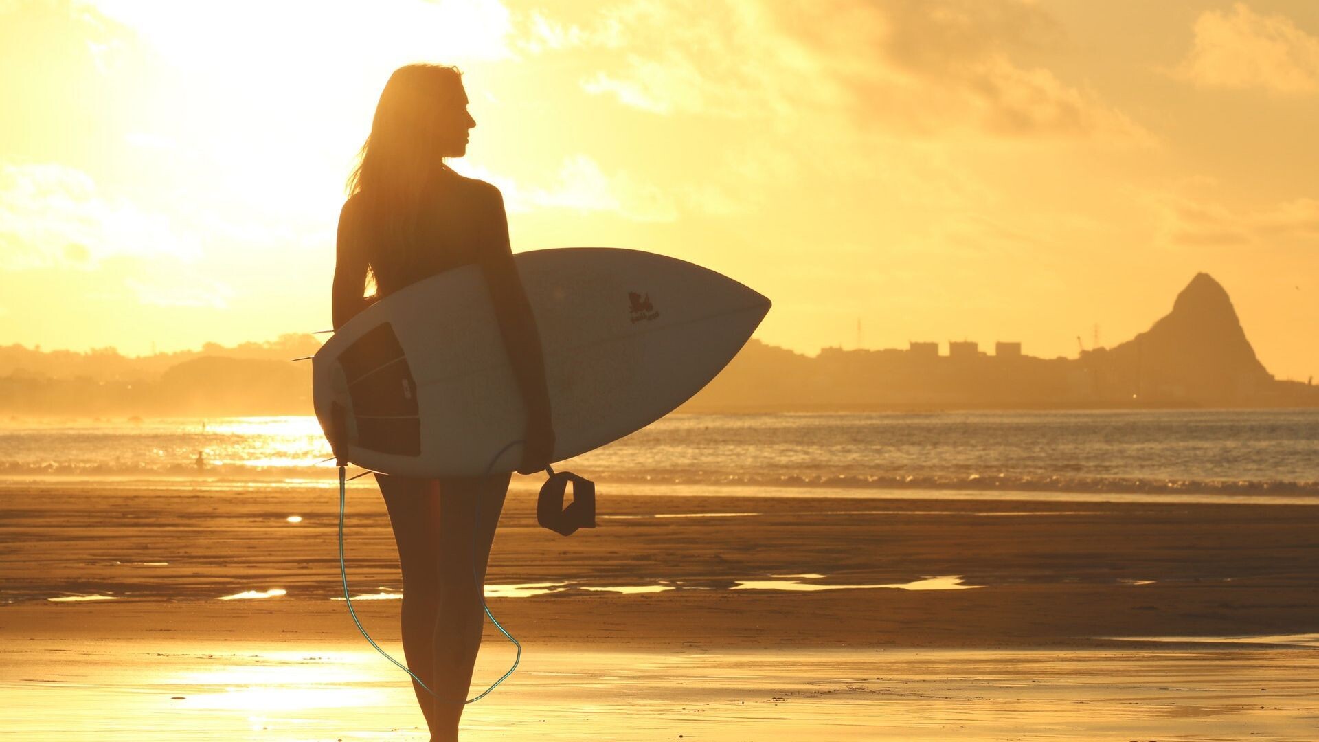 Girl Surfing: Riding a surfboard at sunset, Oahu's Waikiki Beach, Hawaii. 1920x1080 Full HD Background.