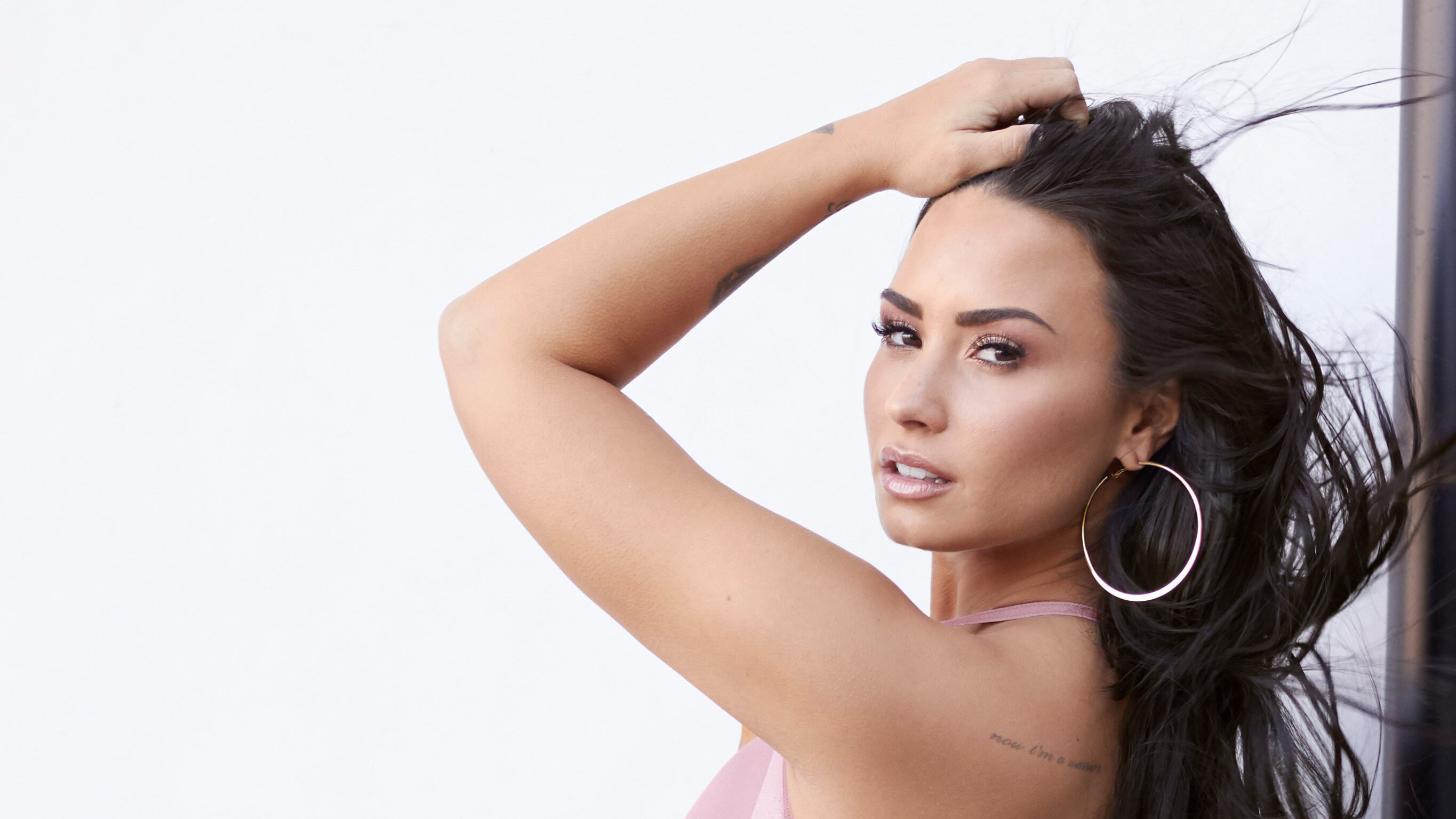 Demi Lovato: Her third studio album, Unbroken (2011), spawned the U.S. platinum-certified single "Skyscraper". 2730x1540 HD Background.