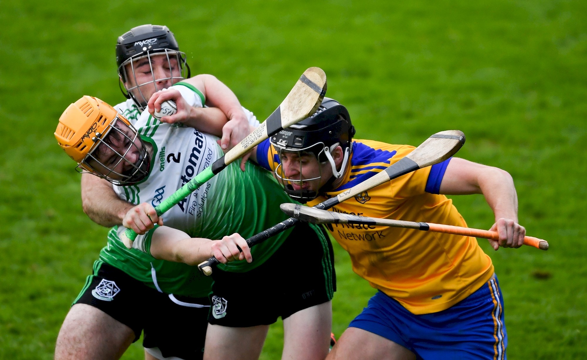 Hurling: Shane Barrett of Na Fianna is tackled by Luke Walsh and Ronan Smith of Lucan Sarsfields. 2000x1230 HD Wallpaper.