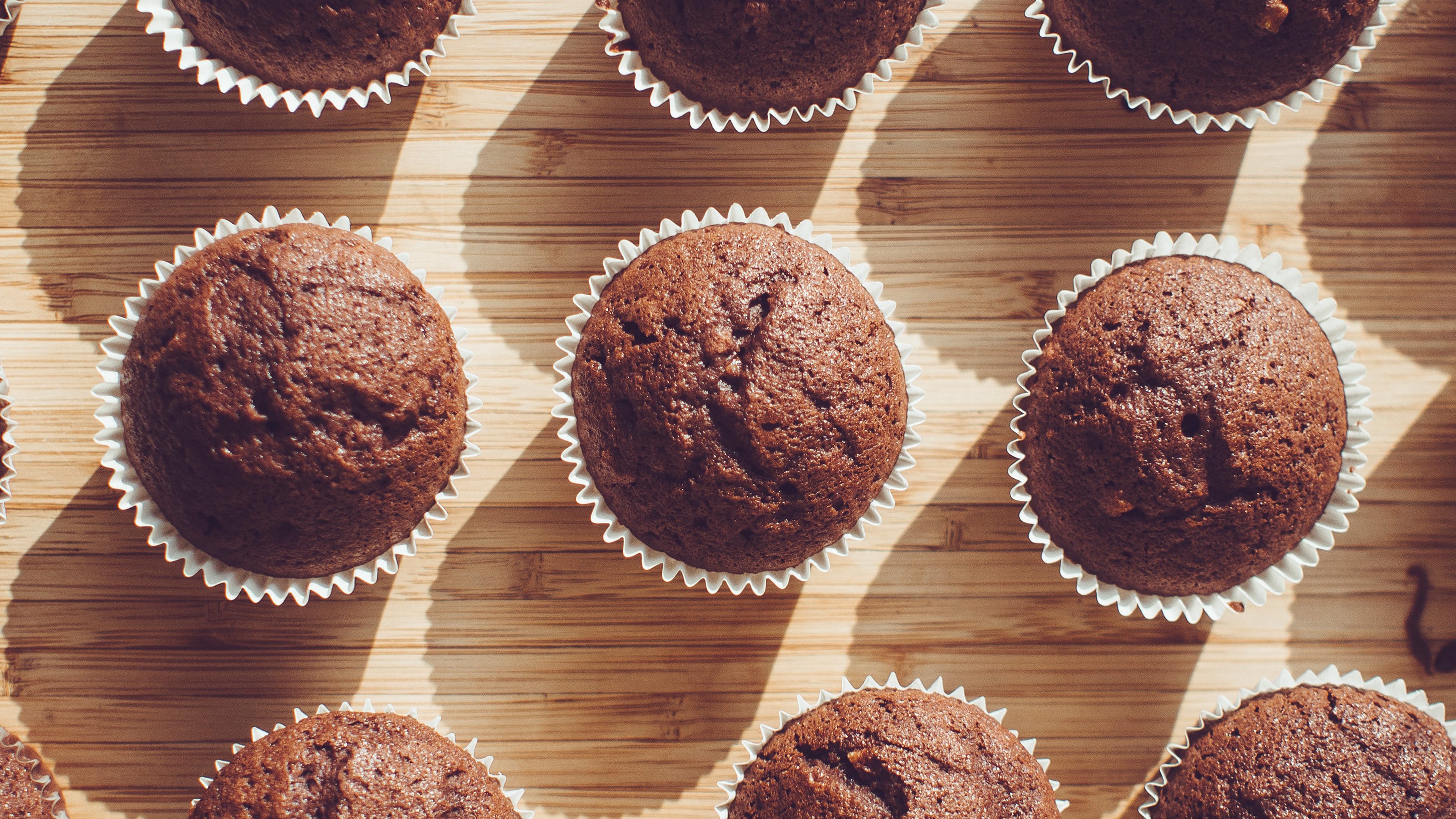 Muffin: A small domed spongy bread– or cake-like baked food. 3840x2160 4K Background.