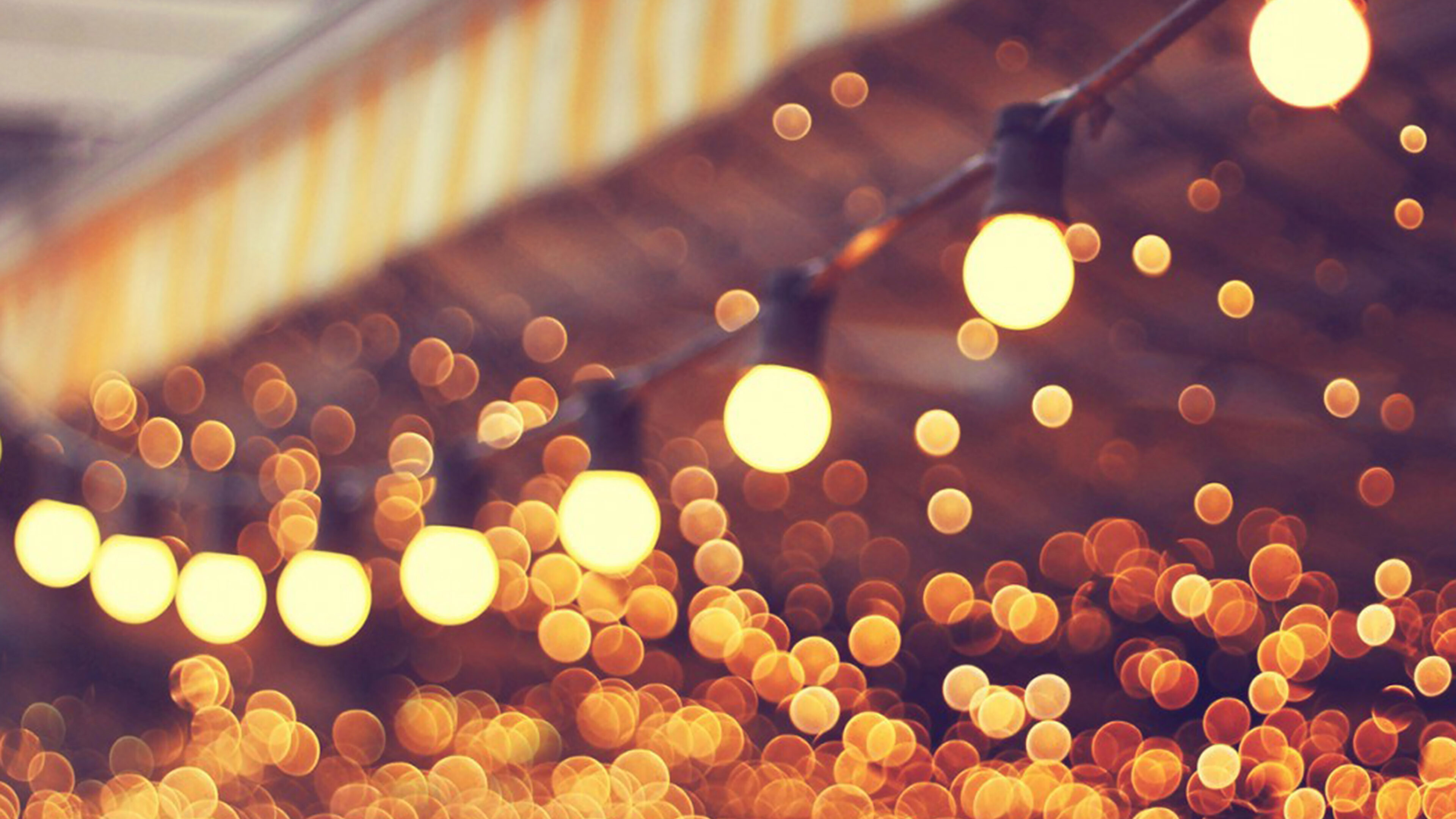 Gold Lights: The traditional ball-shaped glass bulbs, Light bulb decor, Warm white blurry lighting. 3840x2160 4K Background.