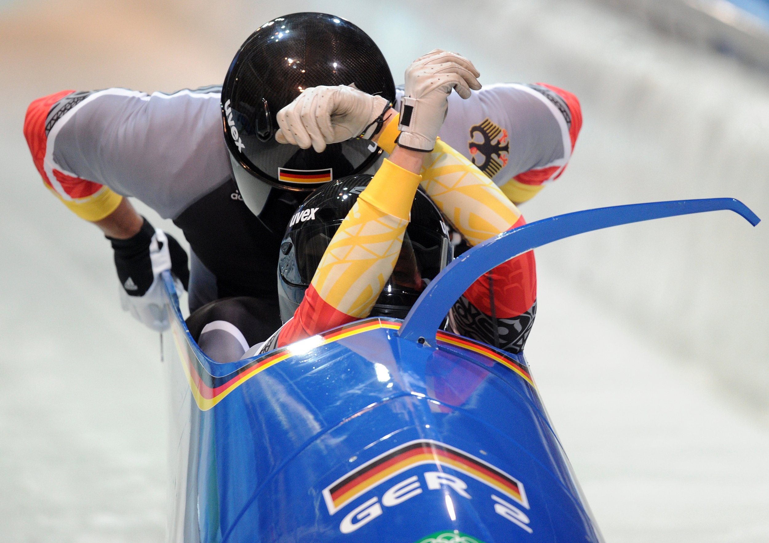 Bobsleigh: The German-2 two-man team piloted by Thomas Florschuetz starts during the Olympic 2010 heats. 2500x1770 HD Background.