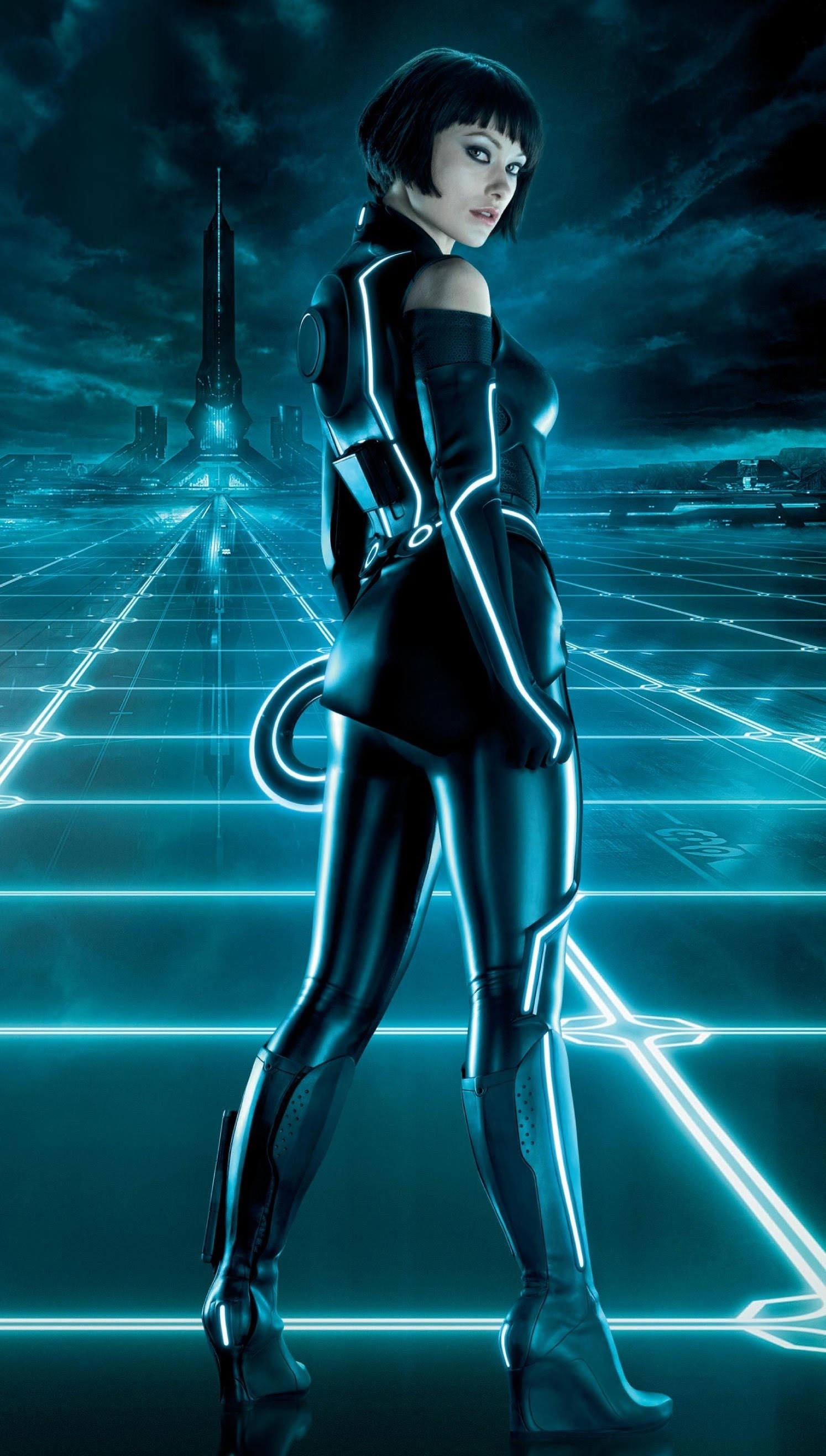Tron (Movie): Quorra, an adept warrior, and confidante of Kevin Flynn in the Grid. 1500x2640 HD Background.