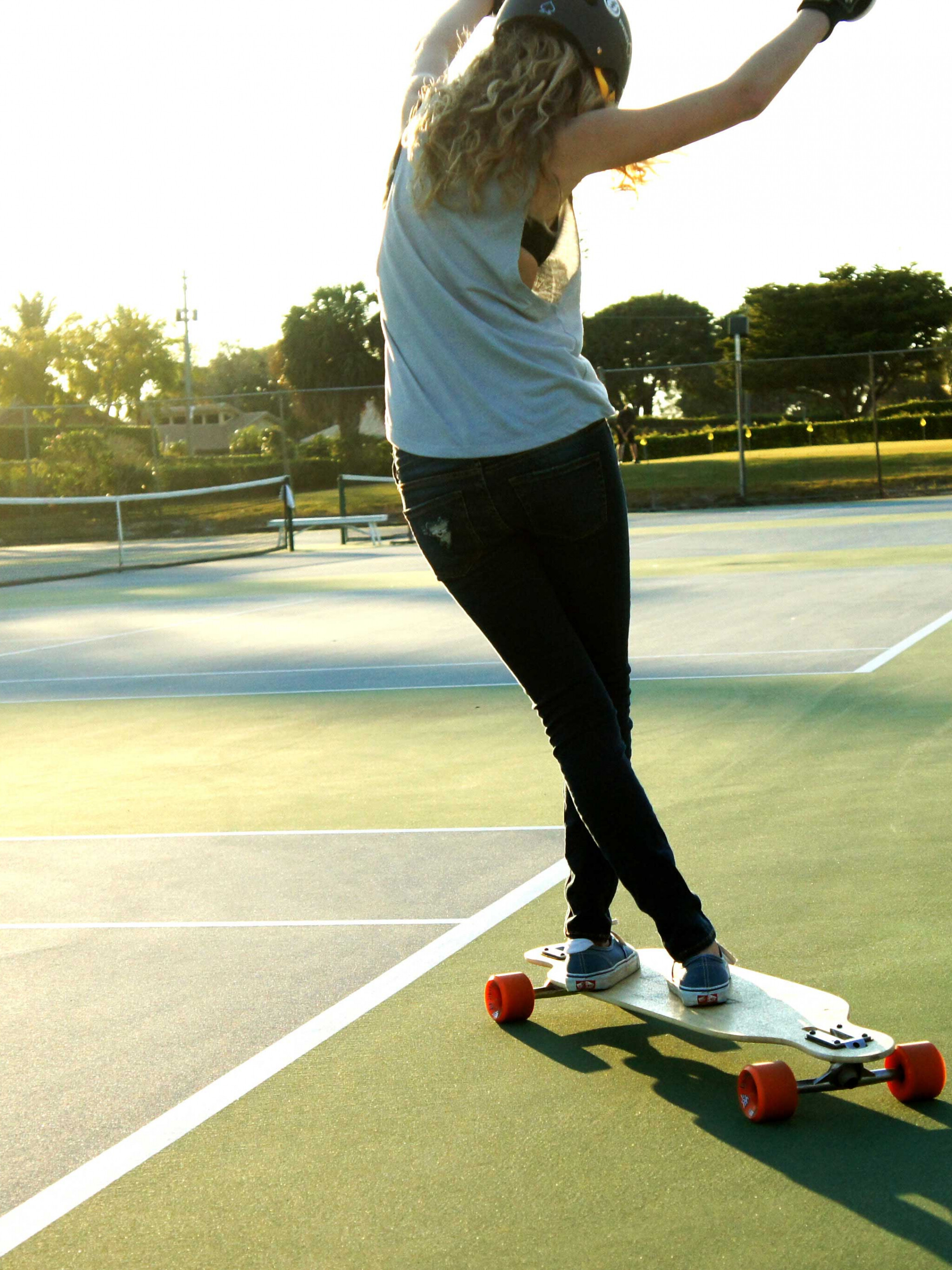 Girl Skateboarding: Longboard dancing, A highly visual and creative outdoor activity, Helmet. 2050x2740 HD Wallpaper.