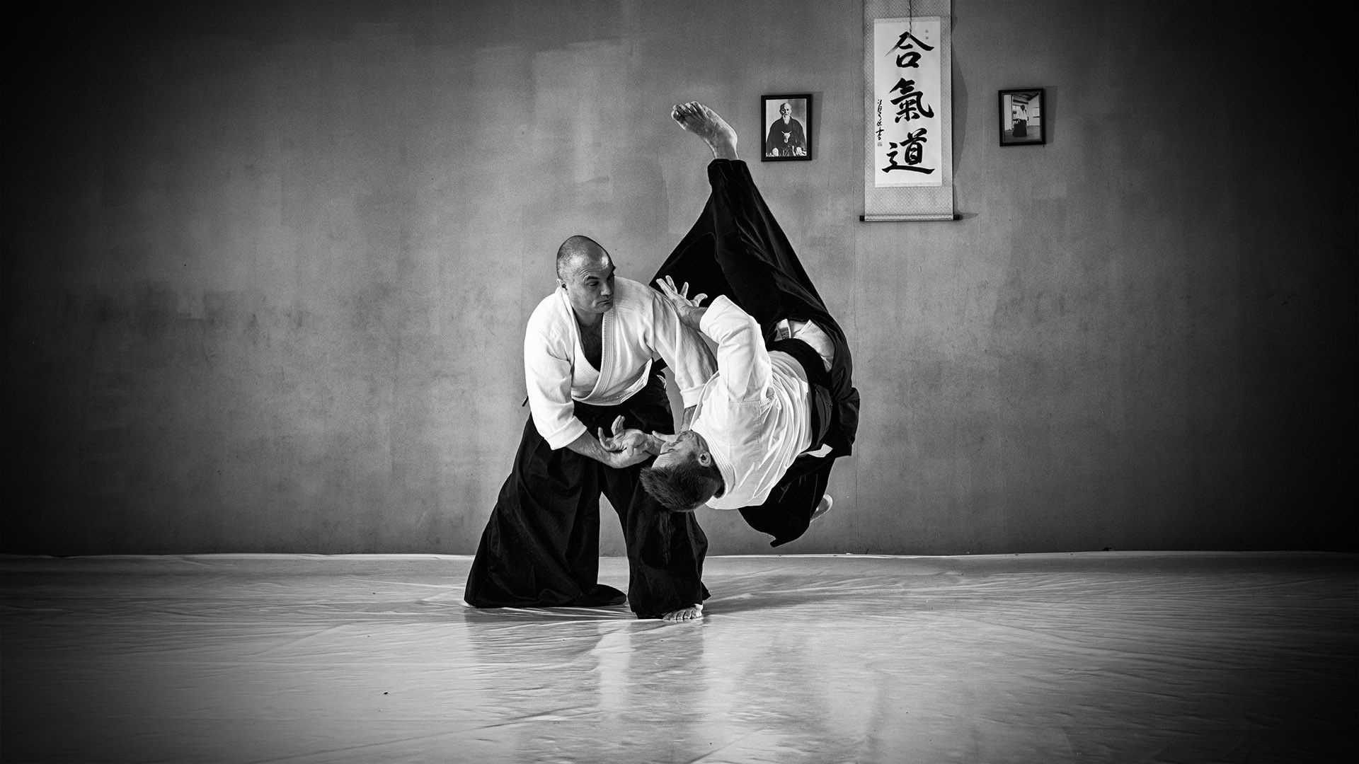 Aikido: Monochrome dojo sparring, Four-direction throw, A training with 6. Dan Sensei. 1920x1080 Full HD Wallpaper.