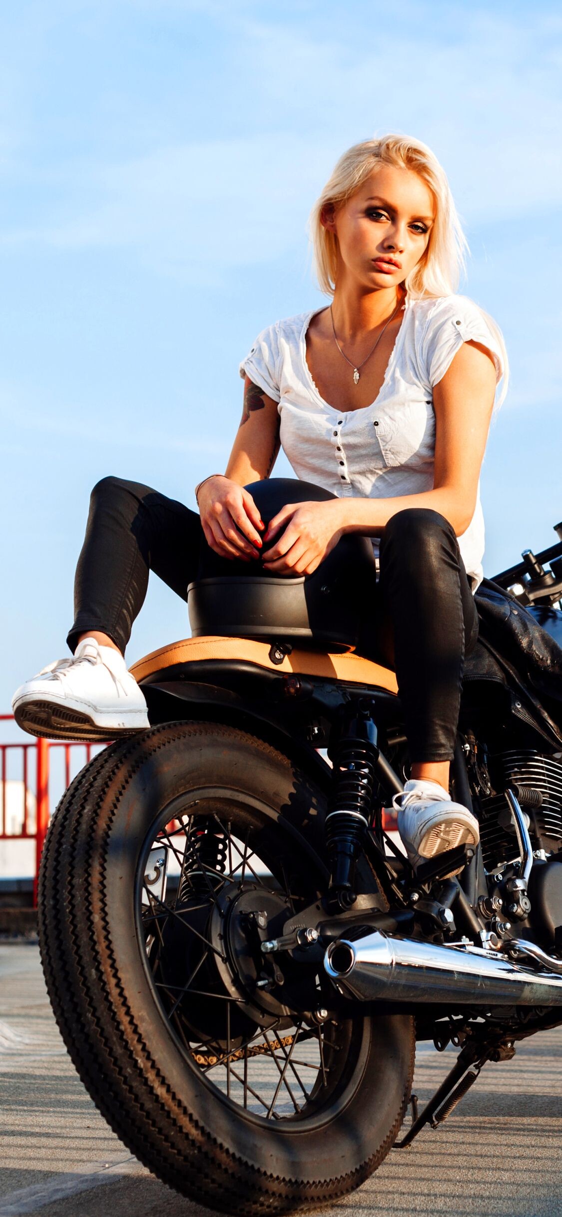Girls and Motorcycles: Exhaust pipe, A full face helmet, A race bike, Female motorcyclist. 1130x2440 HD Background.