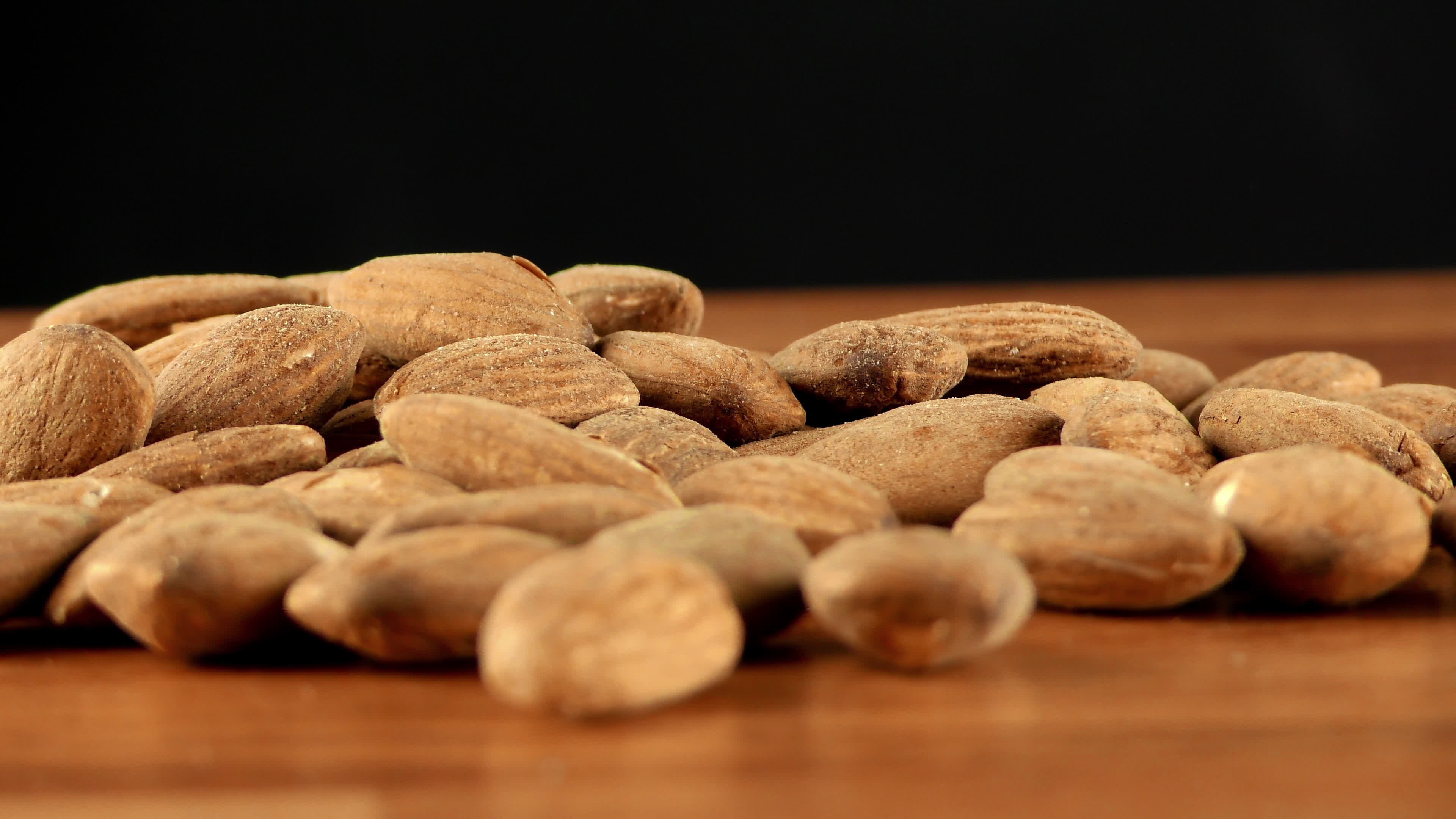 Almonds: The leading source of monounsaturated fat among commonly eaten nuts. 3840x2160 4K Background.