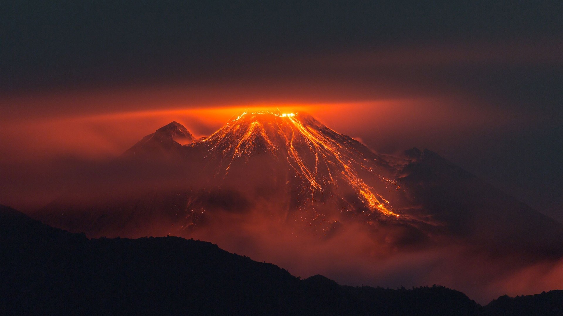 Ecuador: Volcanic eruption, Reventador volcano, Ecuadorian Andes. 1920x1080 Full HD Background.