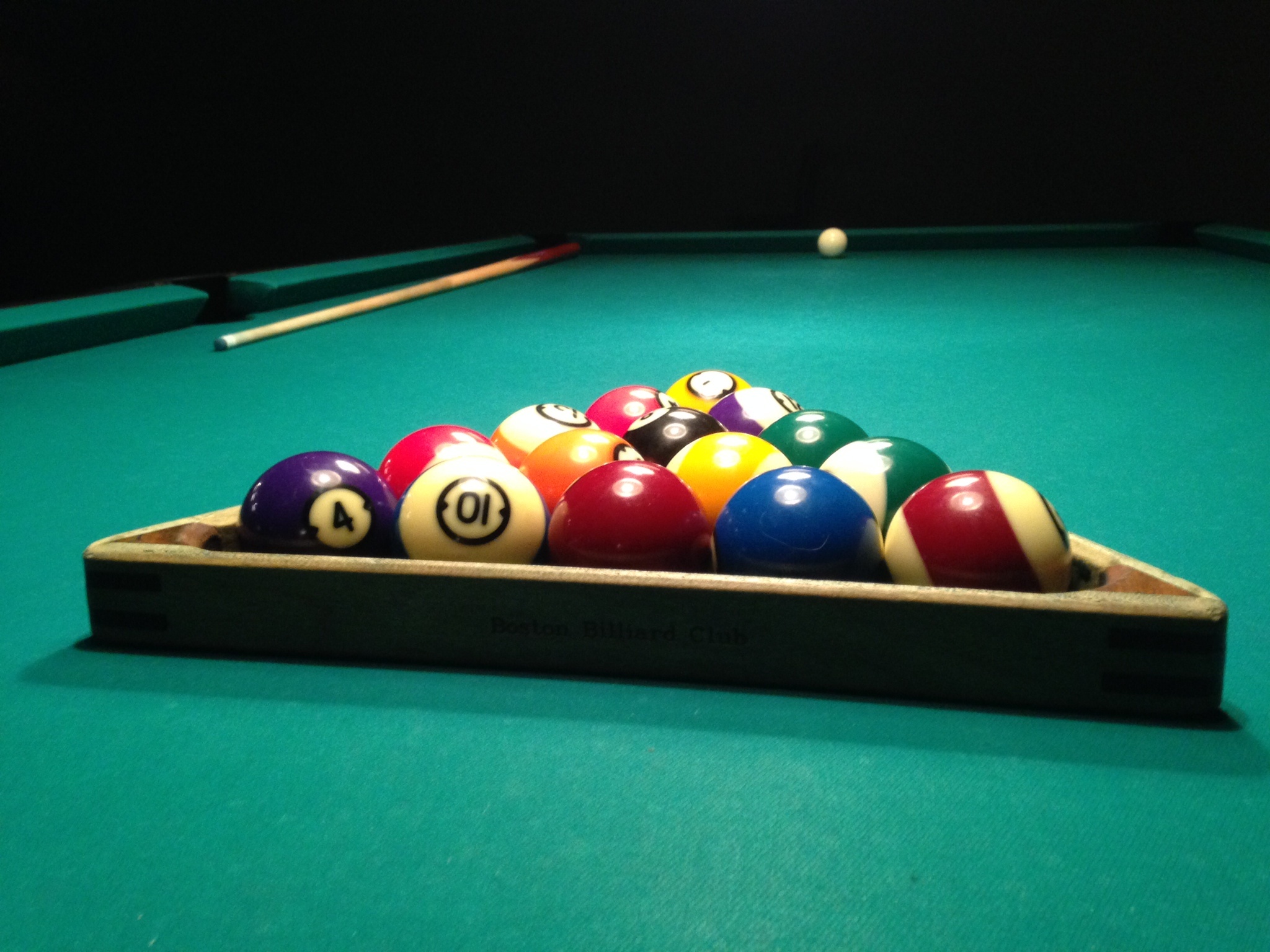 Billiards: Fifteen object balls in a rack with a white cue ball in its position, Last preparations before a break shot, Staff. 2050x1540 HD Background.