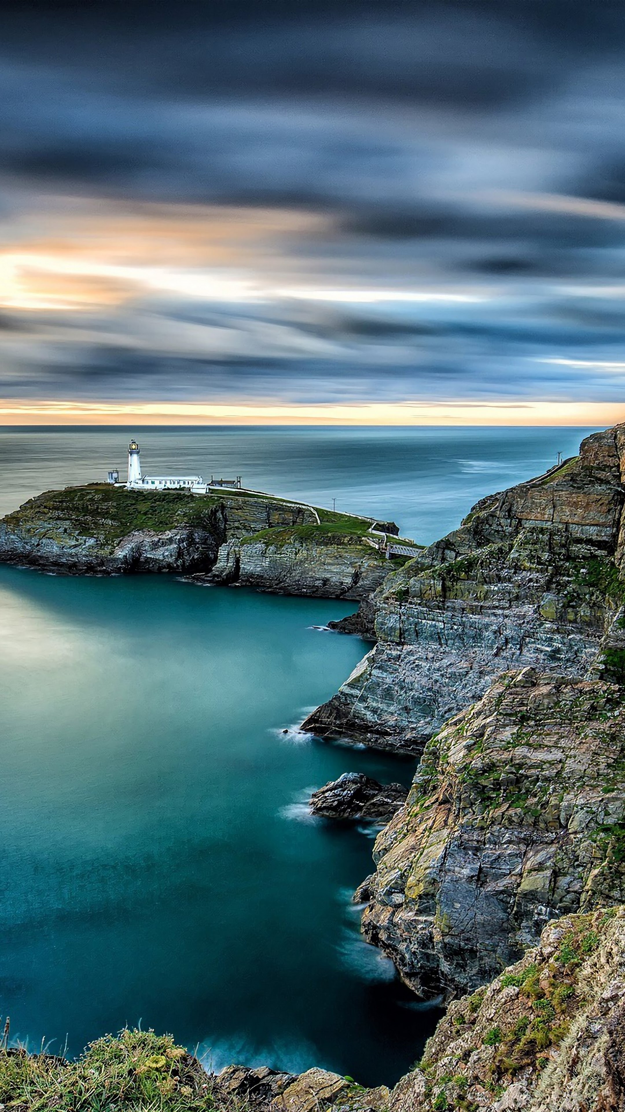 Seascape: South Stack Cliffs RSPB reserve, Holy Island on the North West coast of Anglesey, Wales, Beach lighthouse. 2160x3840 4K Background.