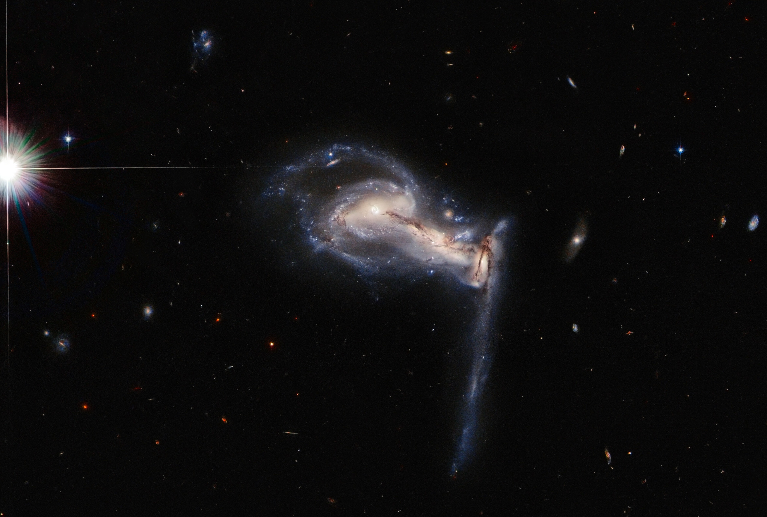 Hubble revelations, Galactic tug of war, Cosmic ballet, Unseen celestial movements, 2560x1730 HD Desktop