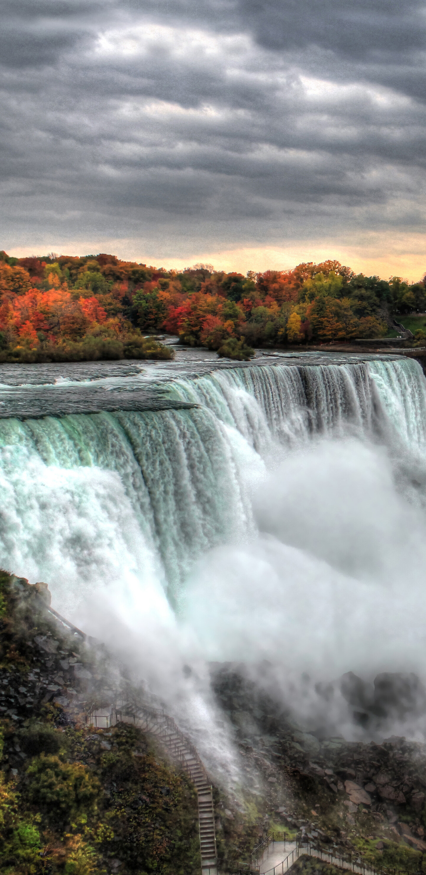 Niagara Falls: A major source of hydroelectric power, A cascade of water falling from a height. 1440x2960 HD Background.
