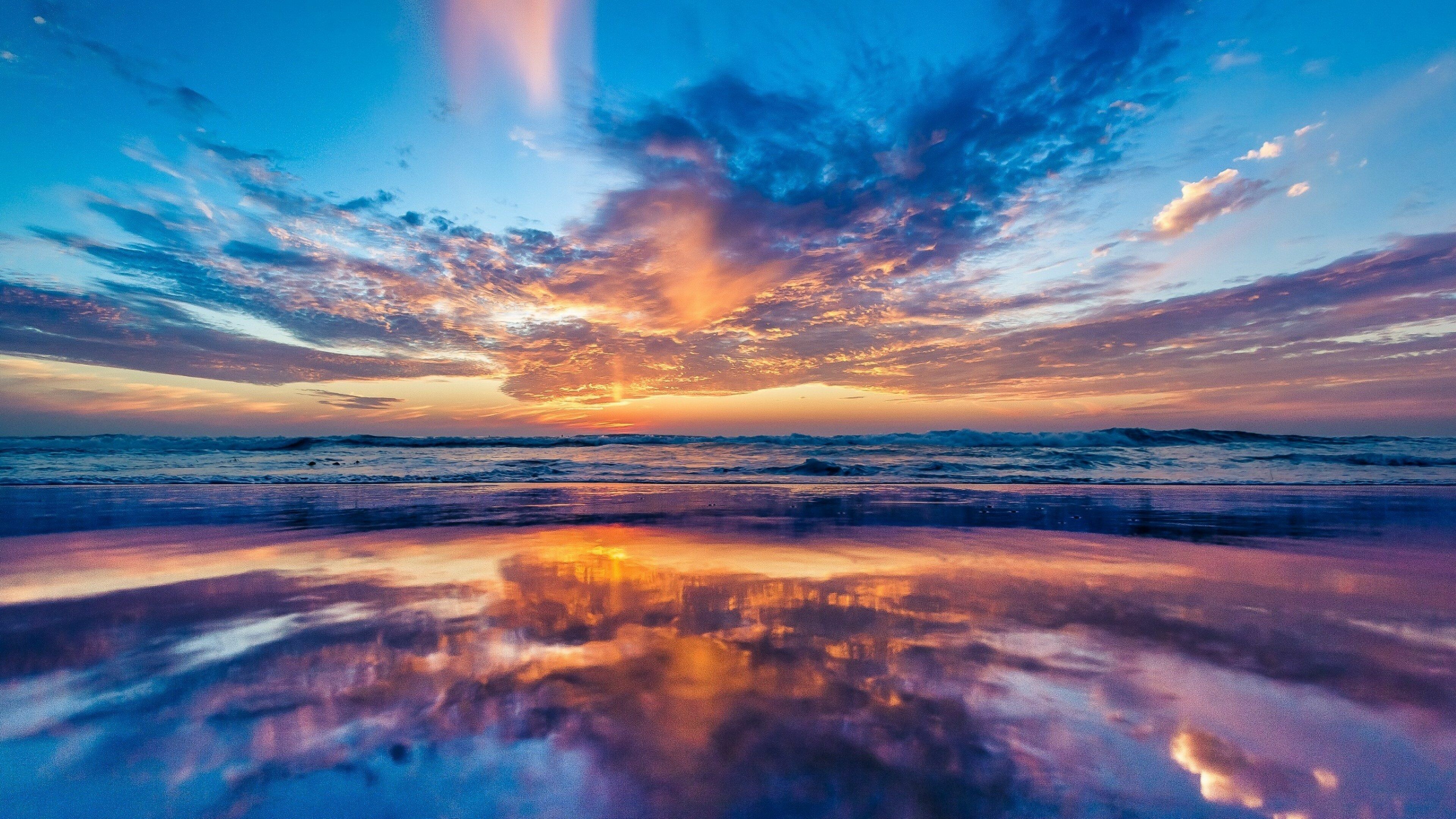Sunrise: Seascape, The sun breaking through a dark-bottomed cloud. 3840x2160 4K Wallpaper.