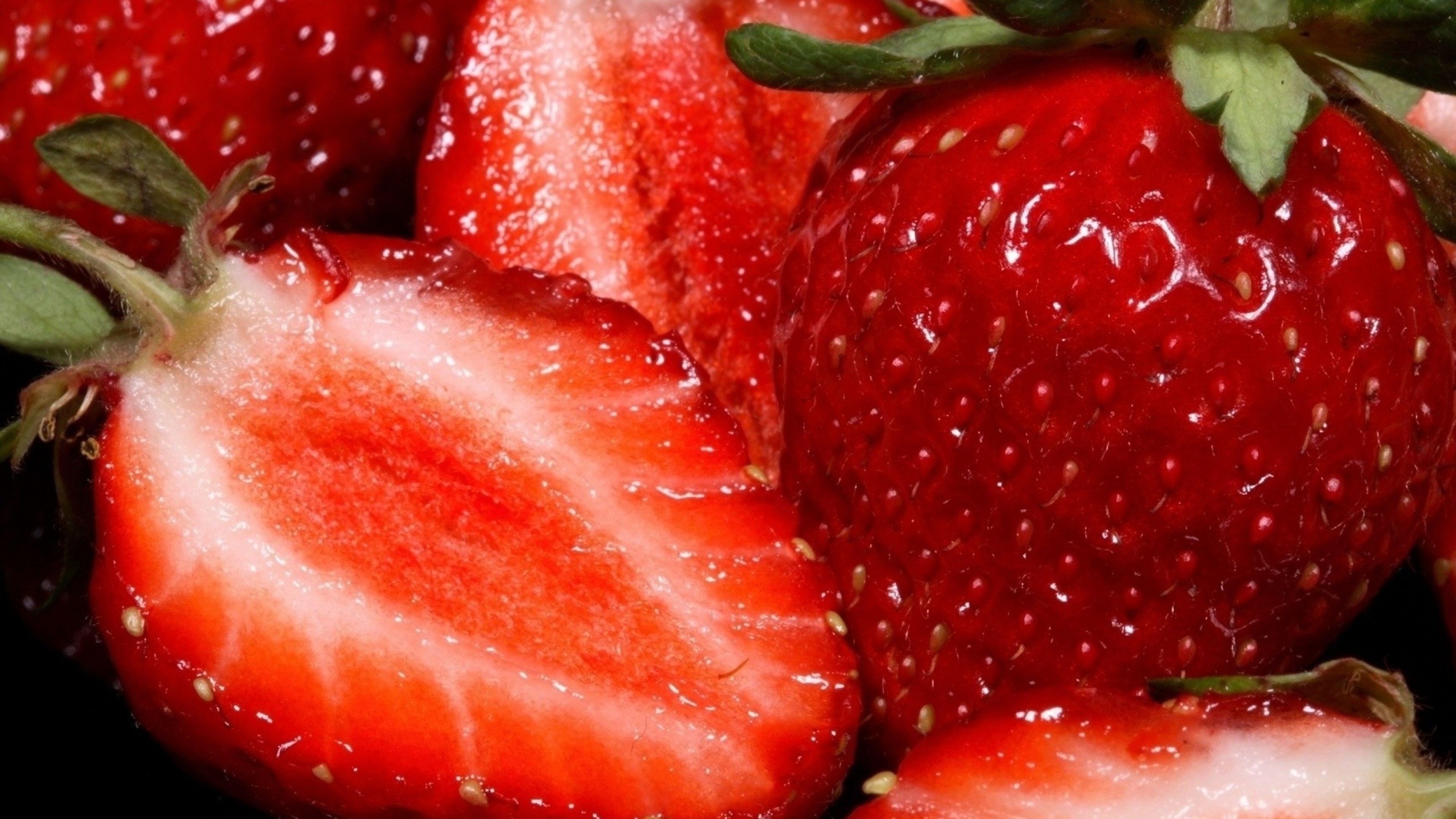 Strawberry: Characteristic aroma, bright red color, juicy texture, and sweetness. 3840x2160 4K Wallpaper.