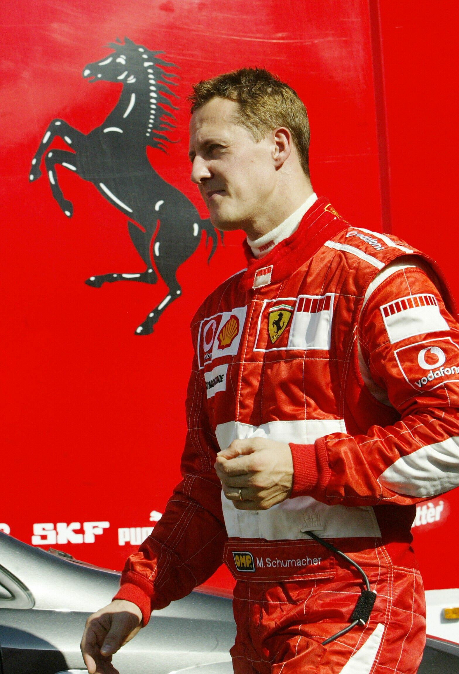 Michael Schumacher: German F1 racer, has dominated the racing world during his career. 1570x2300 HD Background.