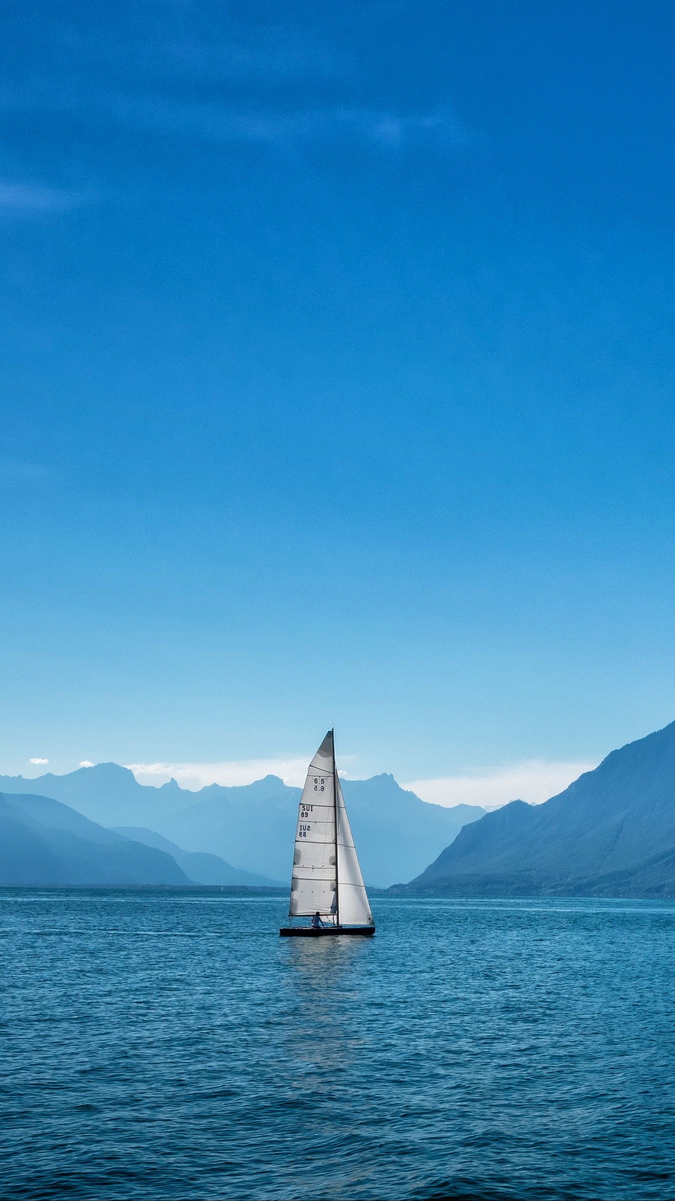 Sail Boat: A dinghy, A type of small open vessel commonly used for recreation, sail training. 1350x2400 HD Wallpaper.