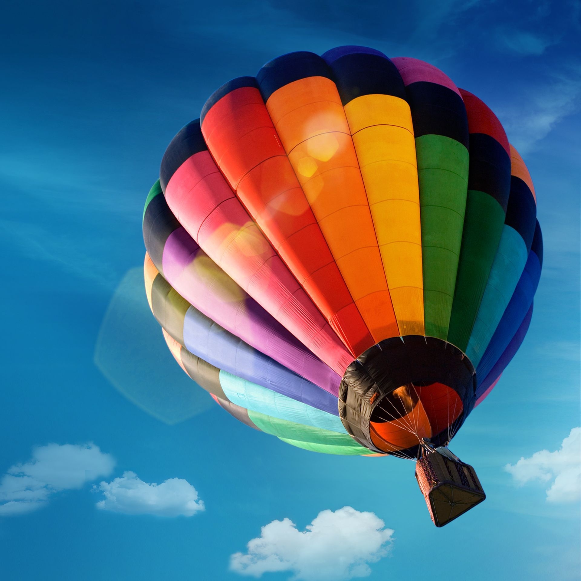 Hot Air Balloon: Air Travel, Aerostat, Triangular Basket, Rainbow-Coloured Envelope. 1920x1920 HD Background.