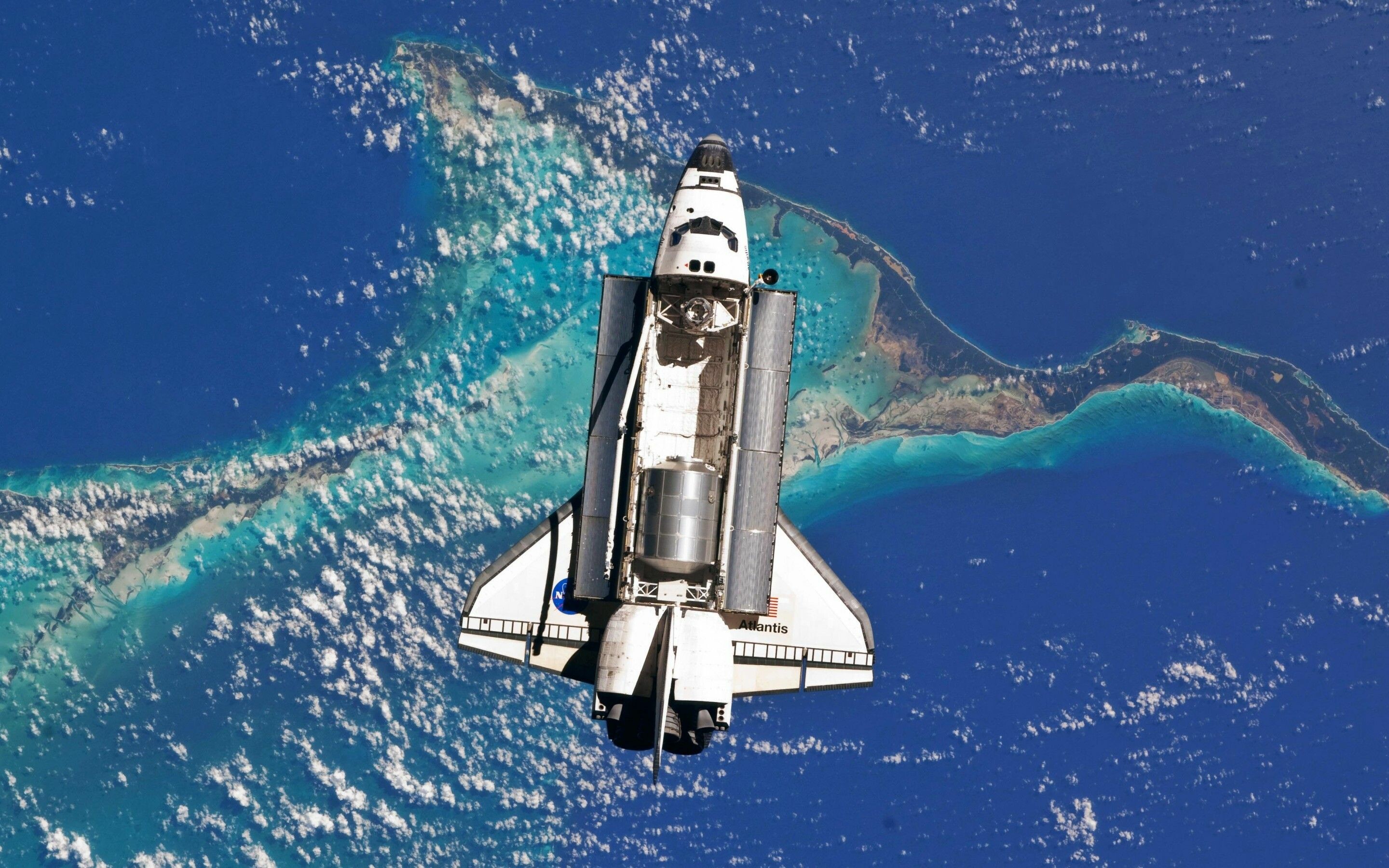 Space Shuttle: The orbiter was protected during reentry by its thermal protection system tiles, Atlantis. 2880x1800 HD Background.