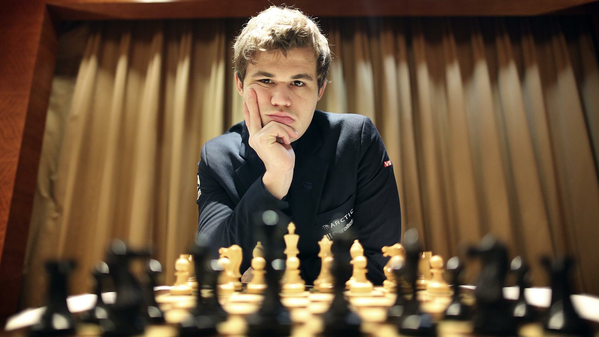Magnus Carlsen: Became World Chess Champion in 2013 by defeating Viswanathan Anand. 2050x1160 HD Background.
