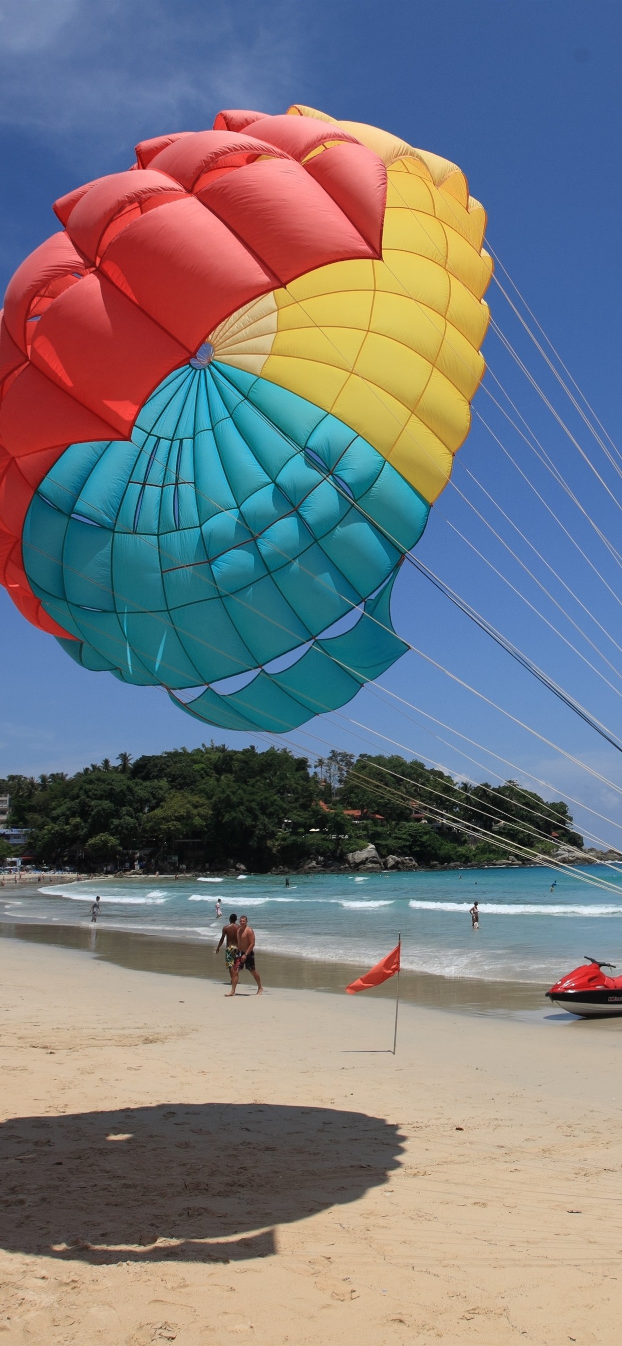 Parasailing: A popular sports activity, A beautifully colored parachute, Parasailers at the beach. 1250x2690 HD Wallpaper.