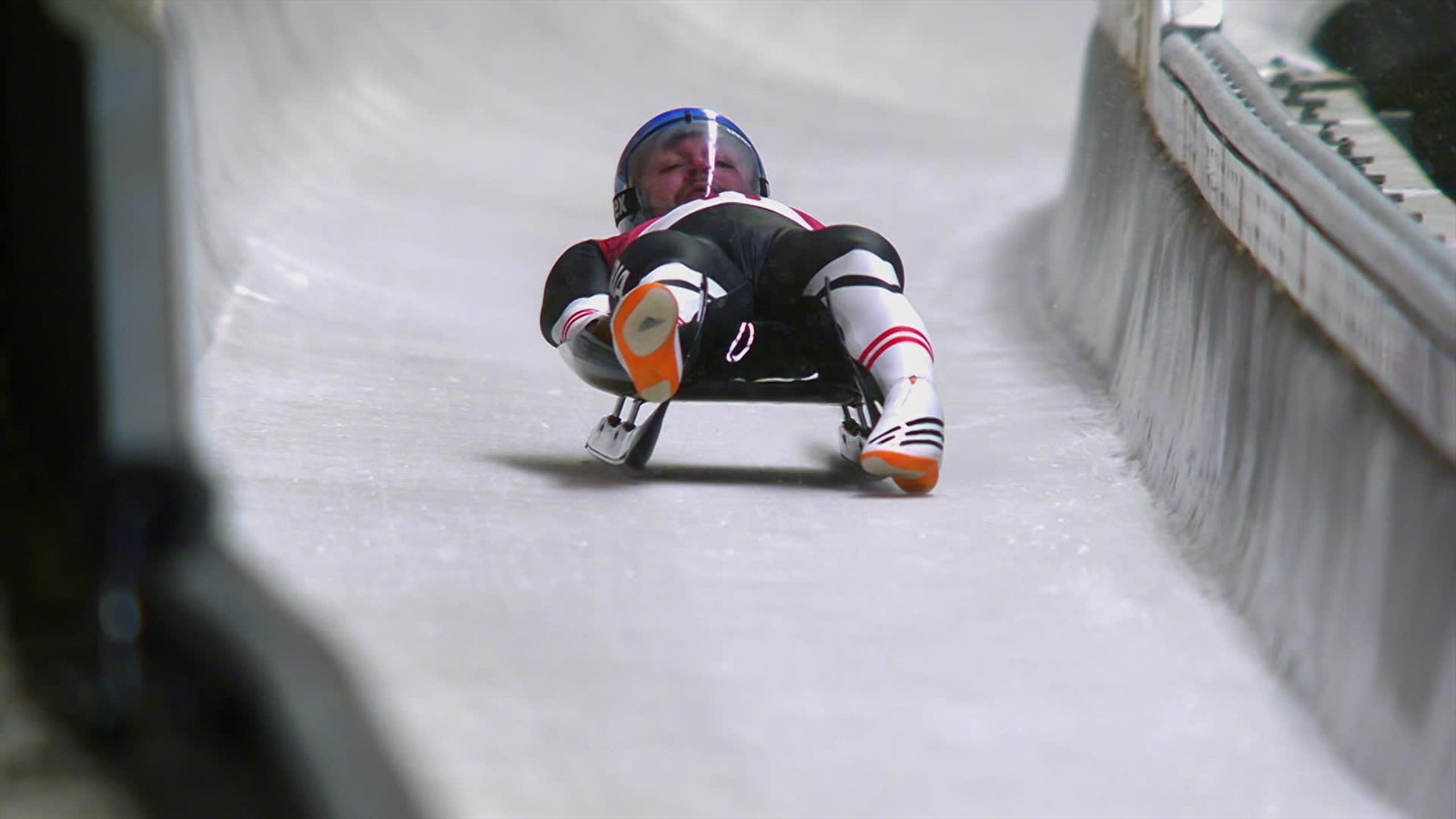 Sledding: Luge, Small One- or Two-Person Sled on which One Sleds Feet-First, Olympic Luger. 2560x1440 HD Background.