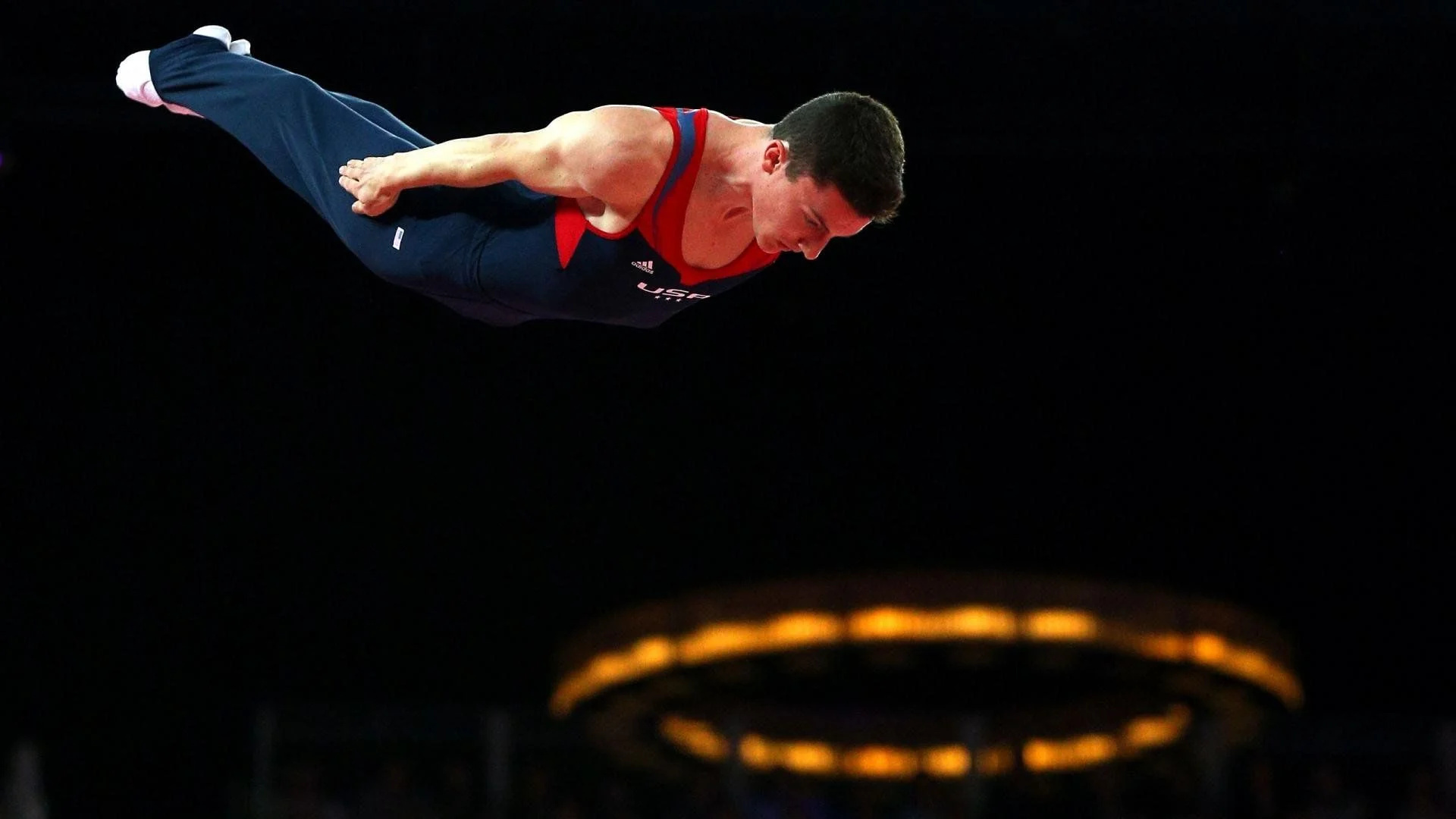 Trampoline gymnastics: Power tumbling, A gymnastics discipline in which participants perform a series of acrobatic skills down a long track. 1920x1080 Full HD Background.