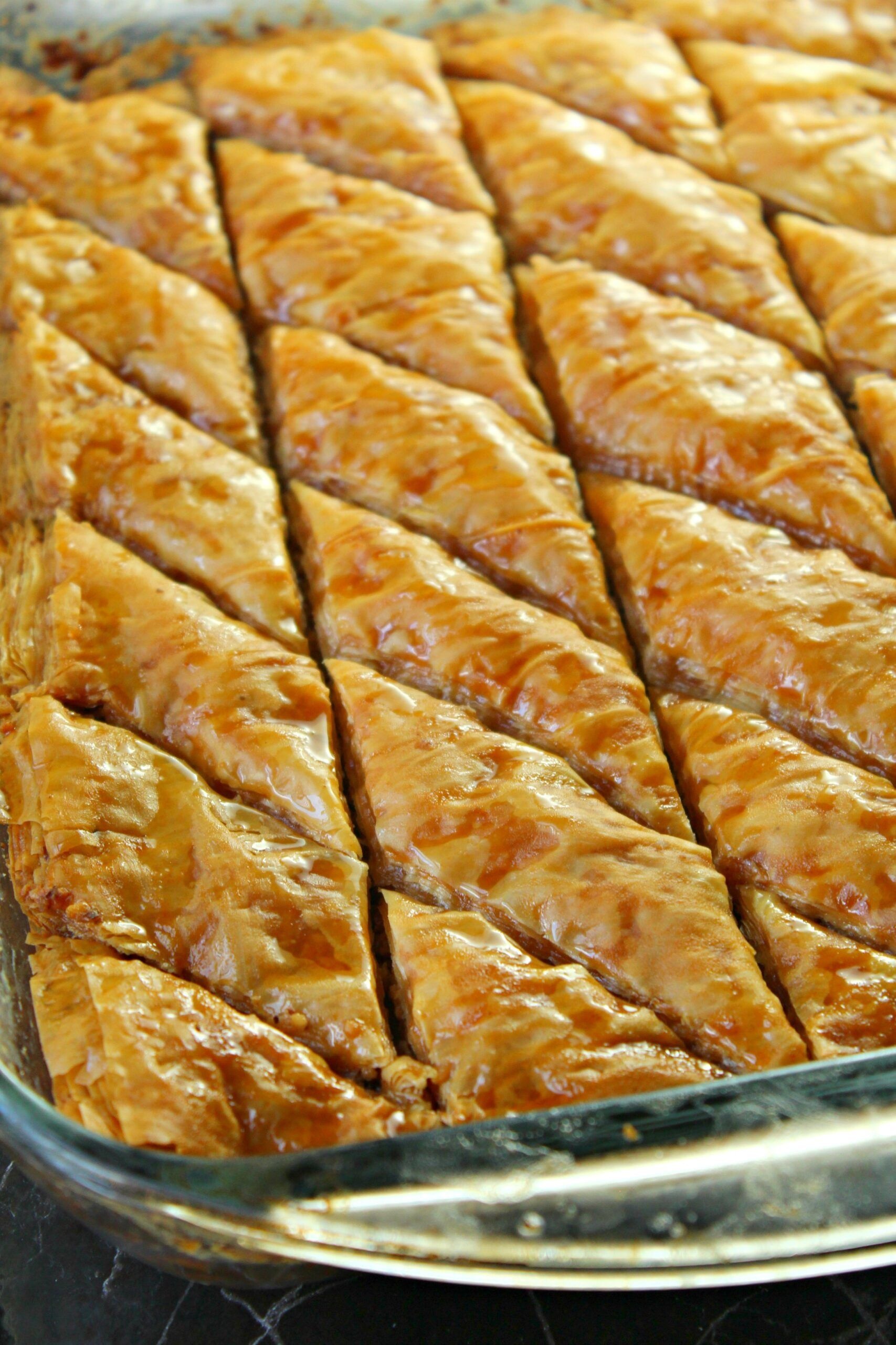 Baklava: A rich, sweet pastry dessert, Layers of filo filled with chopped nuts. 1710x2560 HD Background.