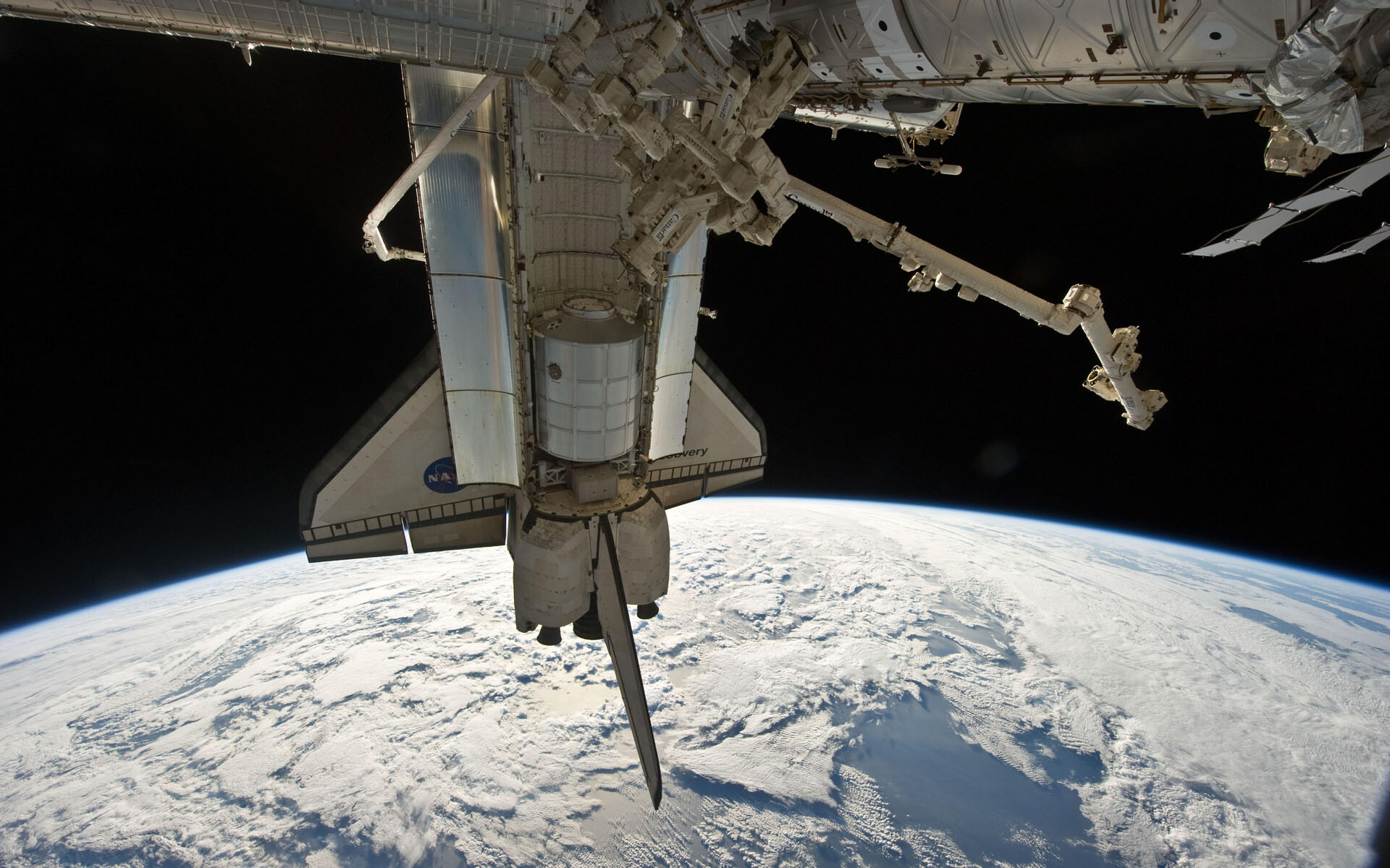 Space Station: Discovery shuttle at the ISS, Low Earth orbit, Astronomical object. 1920x1200 HD Wallpaper.
