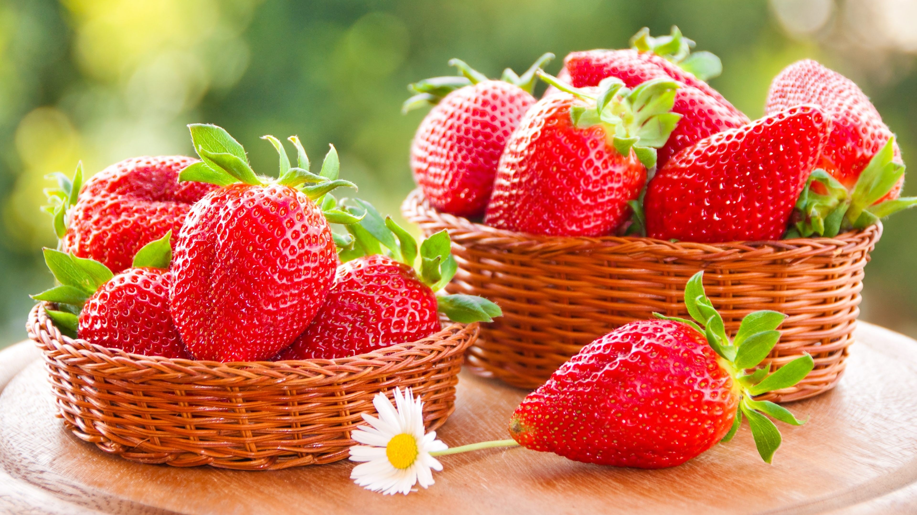Strawberry: A widely grown hybrid species of the genus Fragaria. 3840x2160 4K Wallpaper.