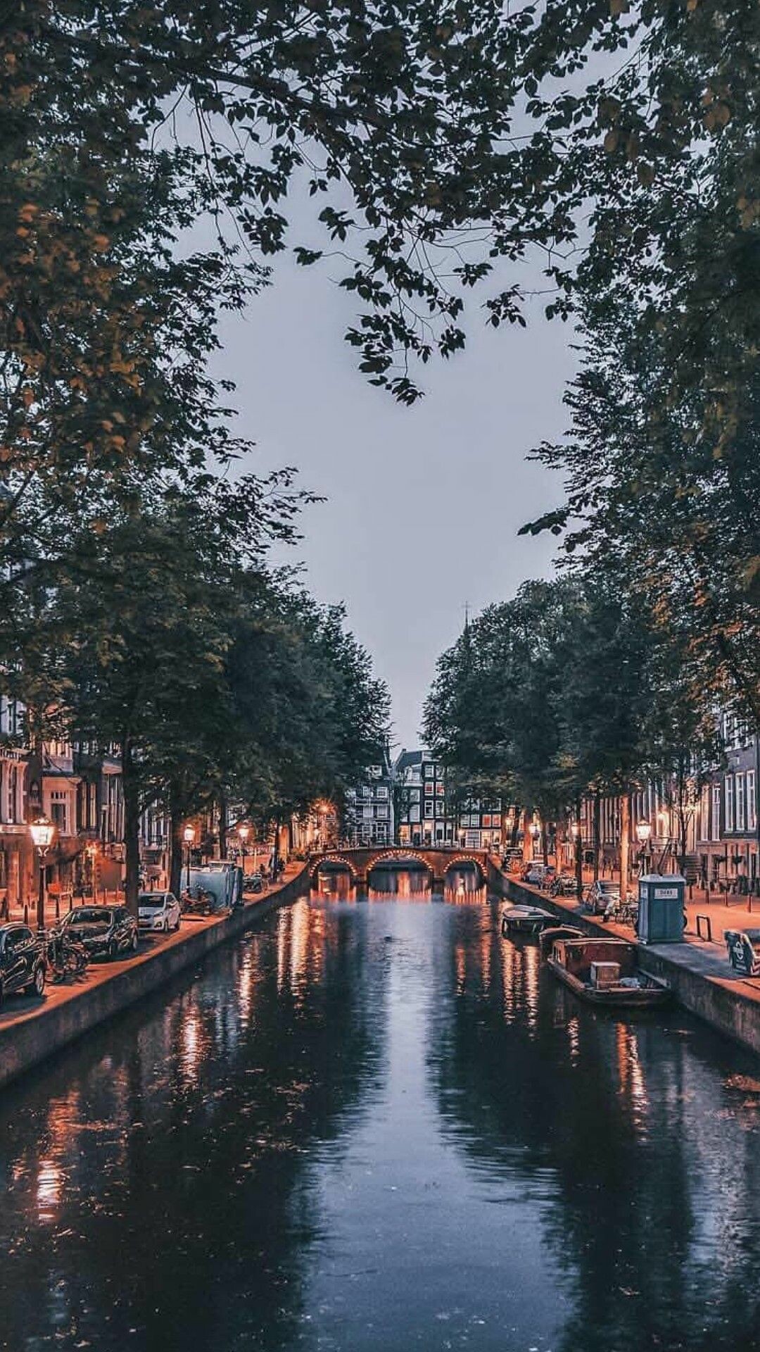 Amsterdam: Dutch city, Famous for picturesque canals and bridges to its historic homes. 1080x1920 Full HD Wallpaper.