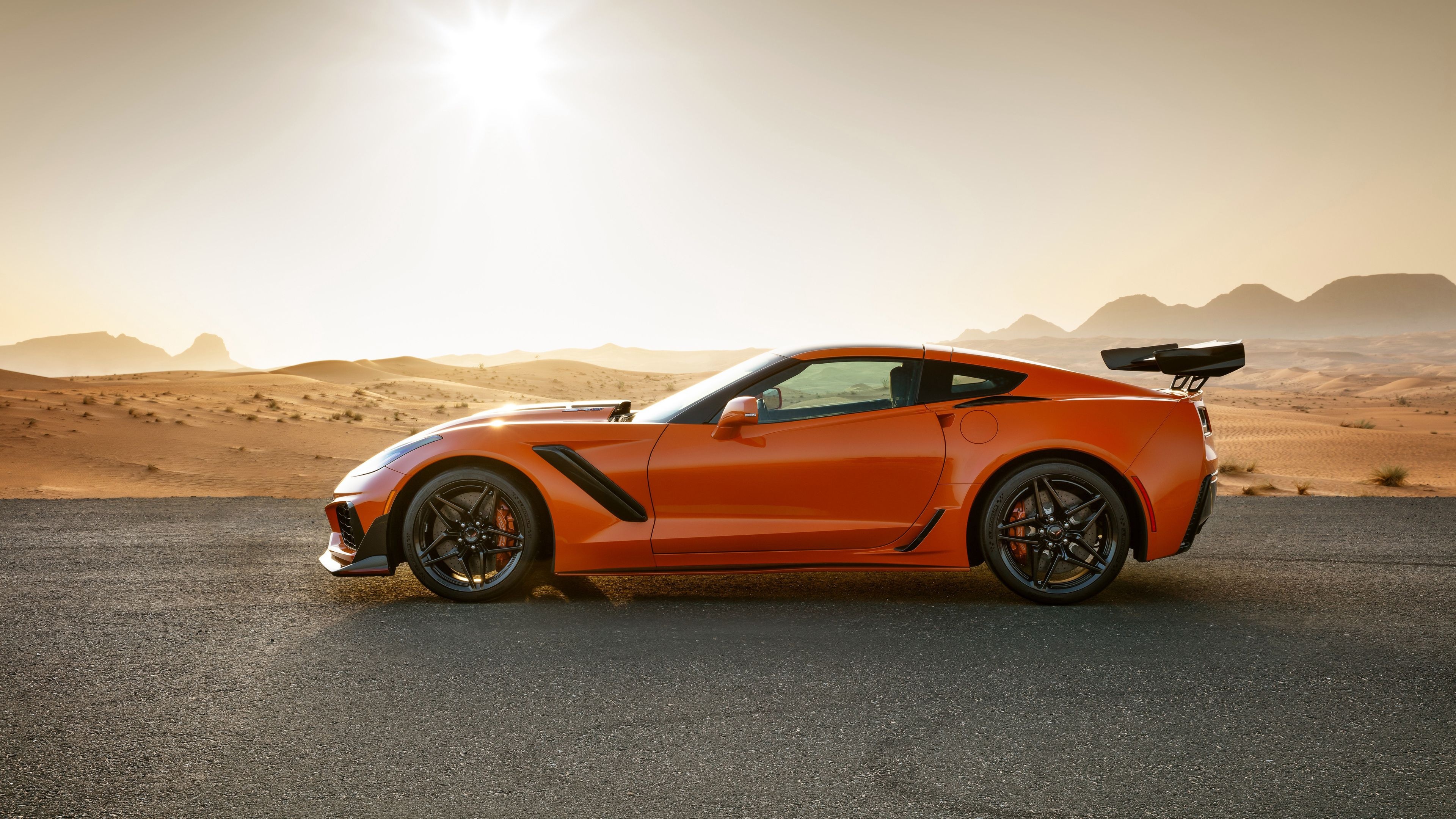 Corvette: ZR1 side view, Two-door convertible, Increased rear wing, Wider racing tires and larger brakes. 3840x2160 4K Wallpaper.