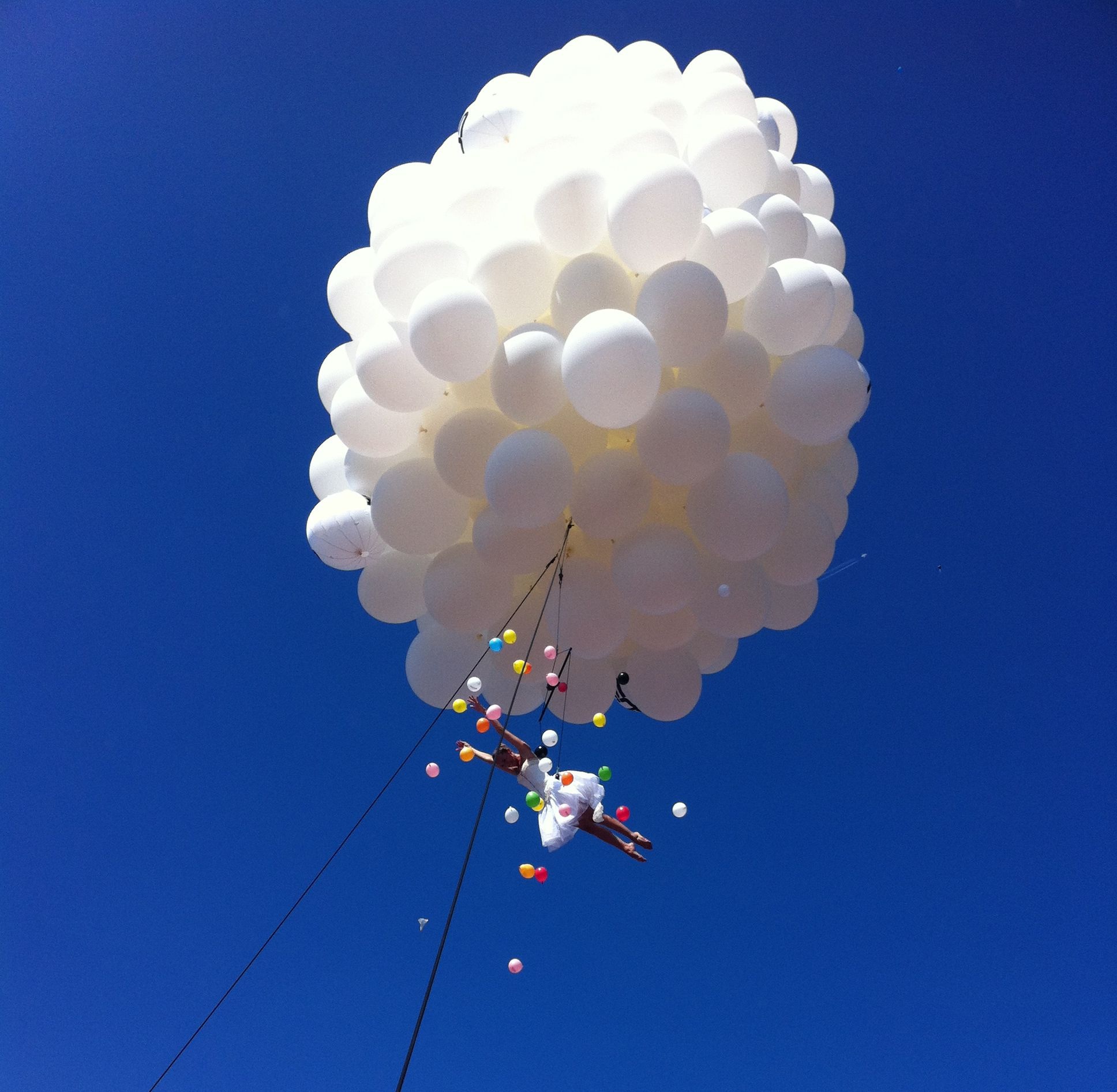 Cluster Ballooning: Molecole Show Performance, Cluster balloons show with an aerialist dancer. 1940x1900 HD Background.