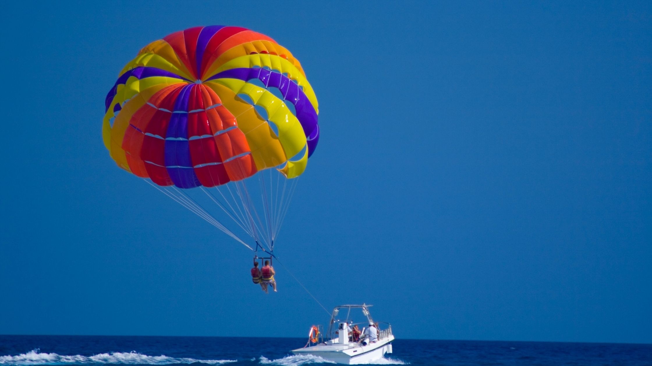 Parasailing: Parachute, Soaring through the air, Reaching the destination height, Barcelona, Parasail. 2240x1260 HD Background.