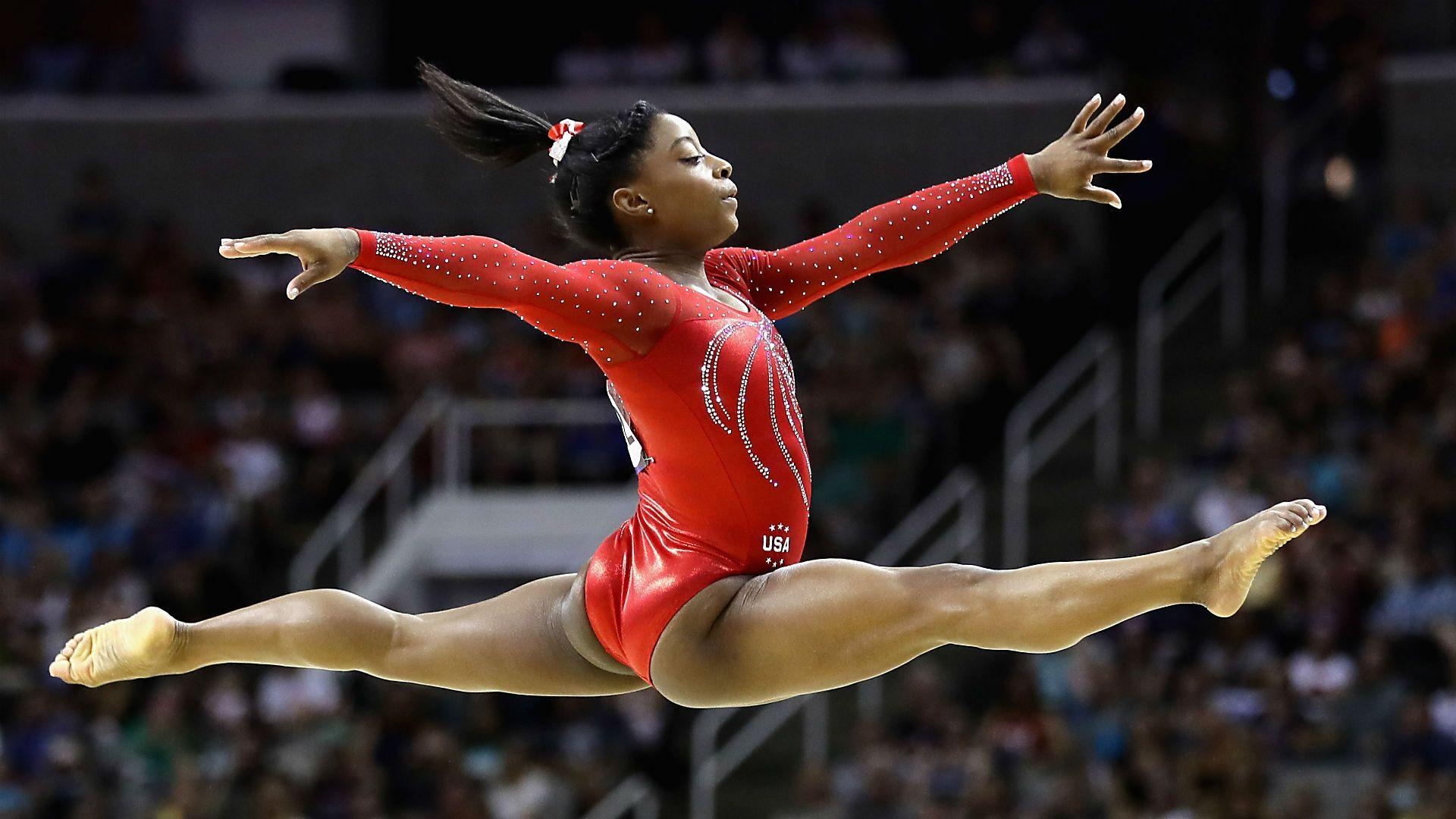 Acrobatic Sports: Simone Biles, An American artistic gymnast, Seven Olympic medals. 1920x1080 Full HD Background.