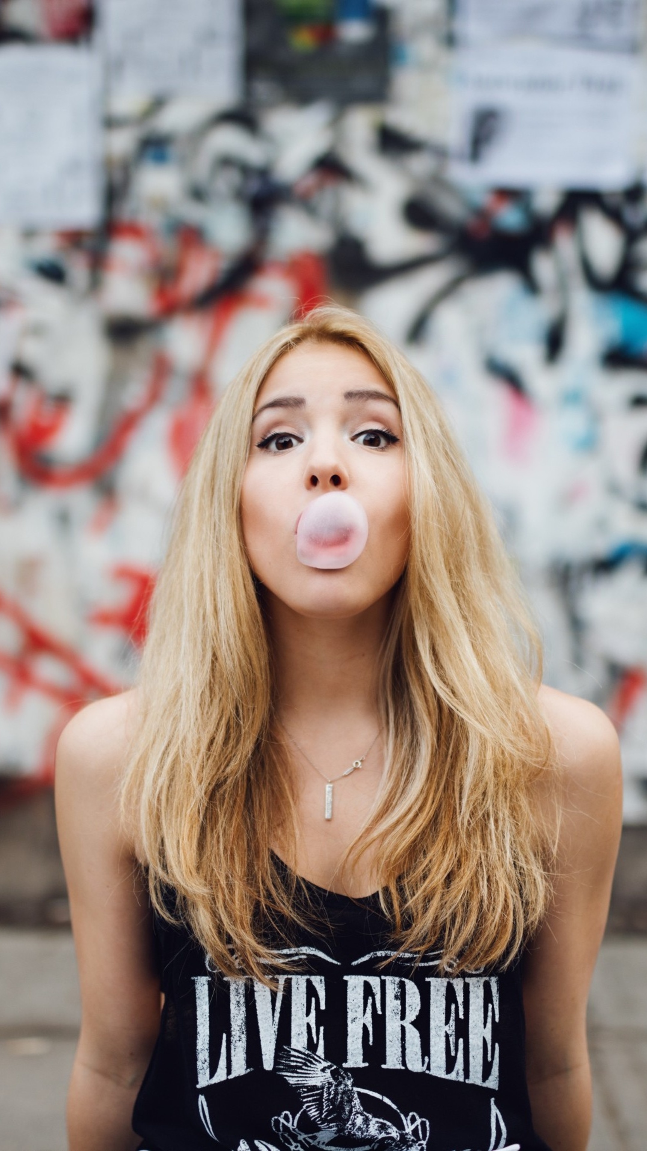 Girl blowing bubble gum, Playful and carefree, Bubble-blowing joy, Photo-worthy moment, 2160x3840 4K Handy