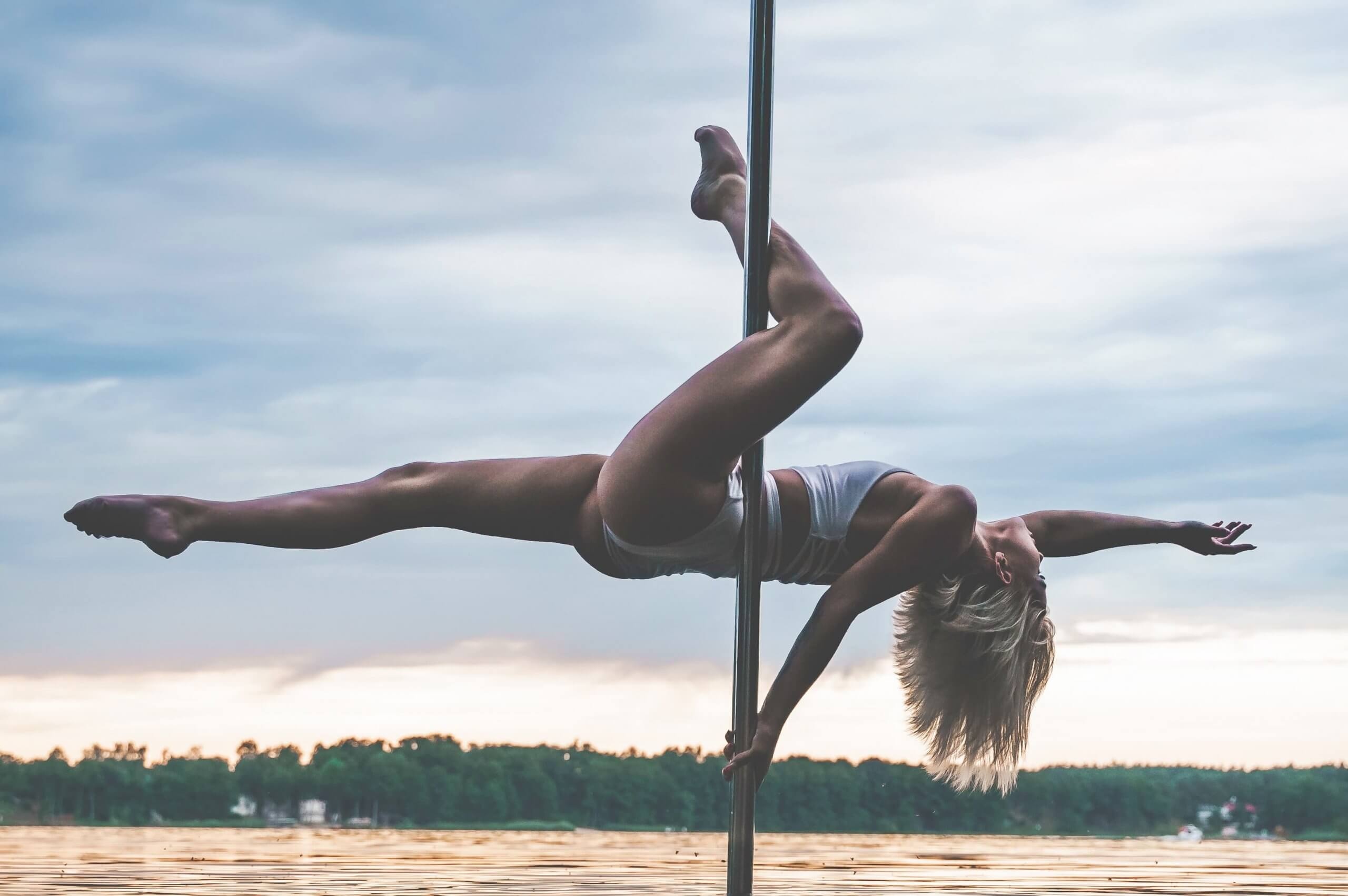 Pole Sports: Perfectly balanced pole dancer, Dance and acrobatics. 2560x1710 HD Background.