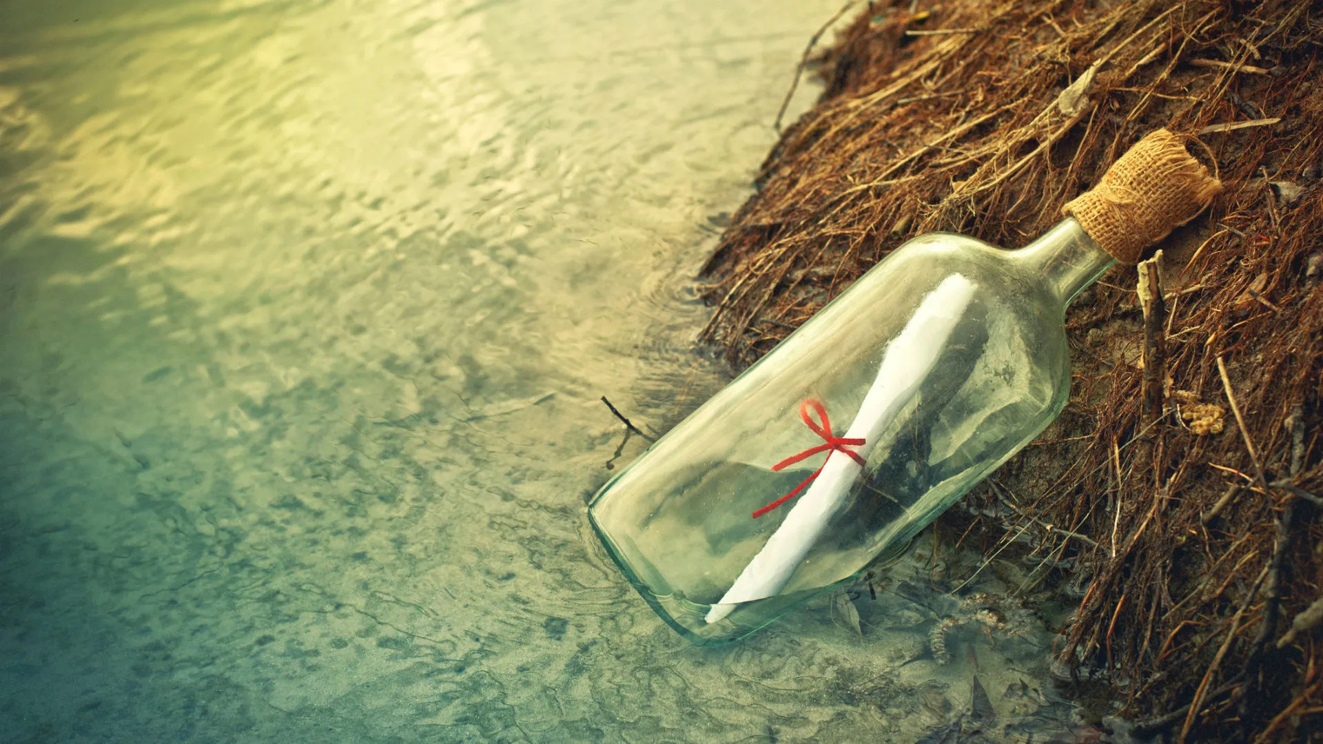 Message in a Bottle: Represents the belief that even when things seem hopeless, there is always the possibility of connection. 1920x1080 Full HD Wallpaper.