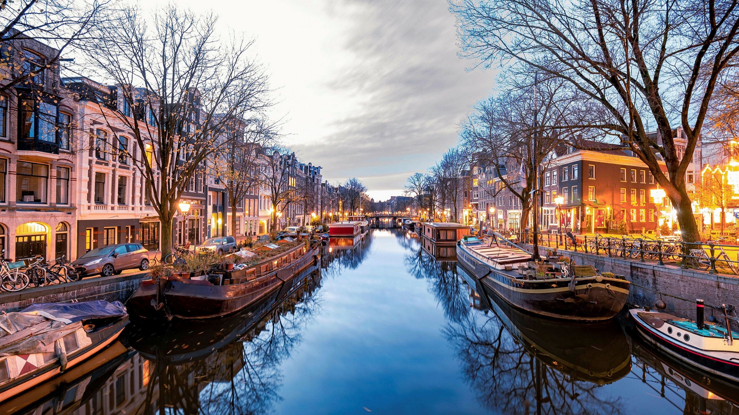 Amsterdam: Dutch city, Known for canals, cobbles and wonky houses. 2400x1350 HD Wallpaper.