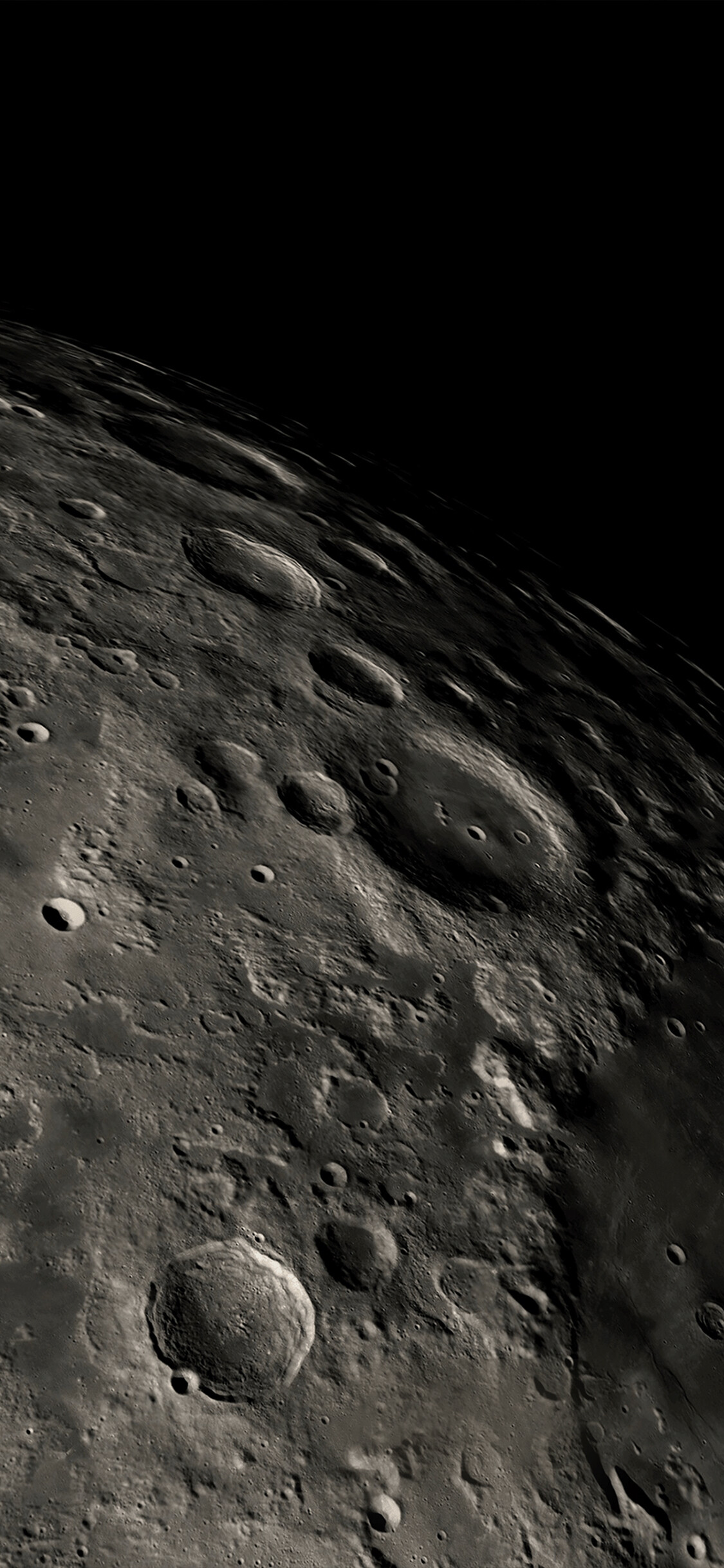 Moon: The moon's surface, covered with dead volcanoes, impact craters, and lava flows. 1130x2440 HD Wallpaper.