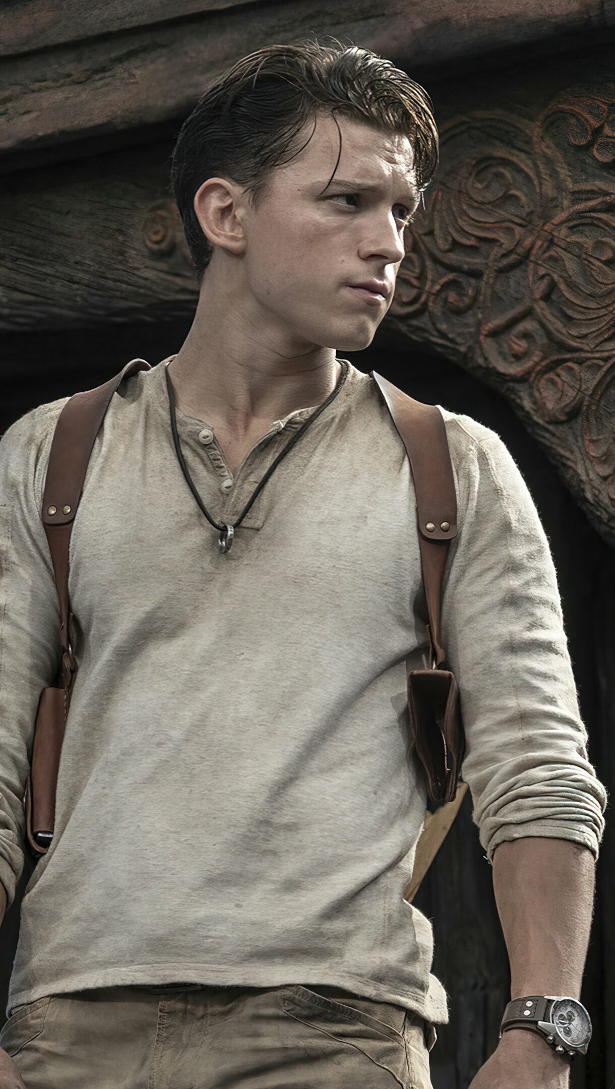 Tom Holland: Nathan "Nate" Drake, a young bartender who is recruited by Sully to find the fabled treasure. 1220x2160 HD Background.