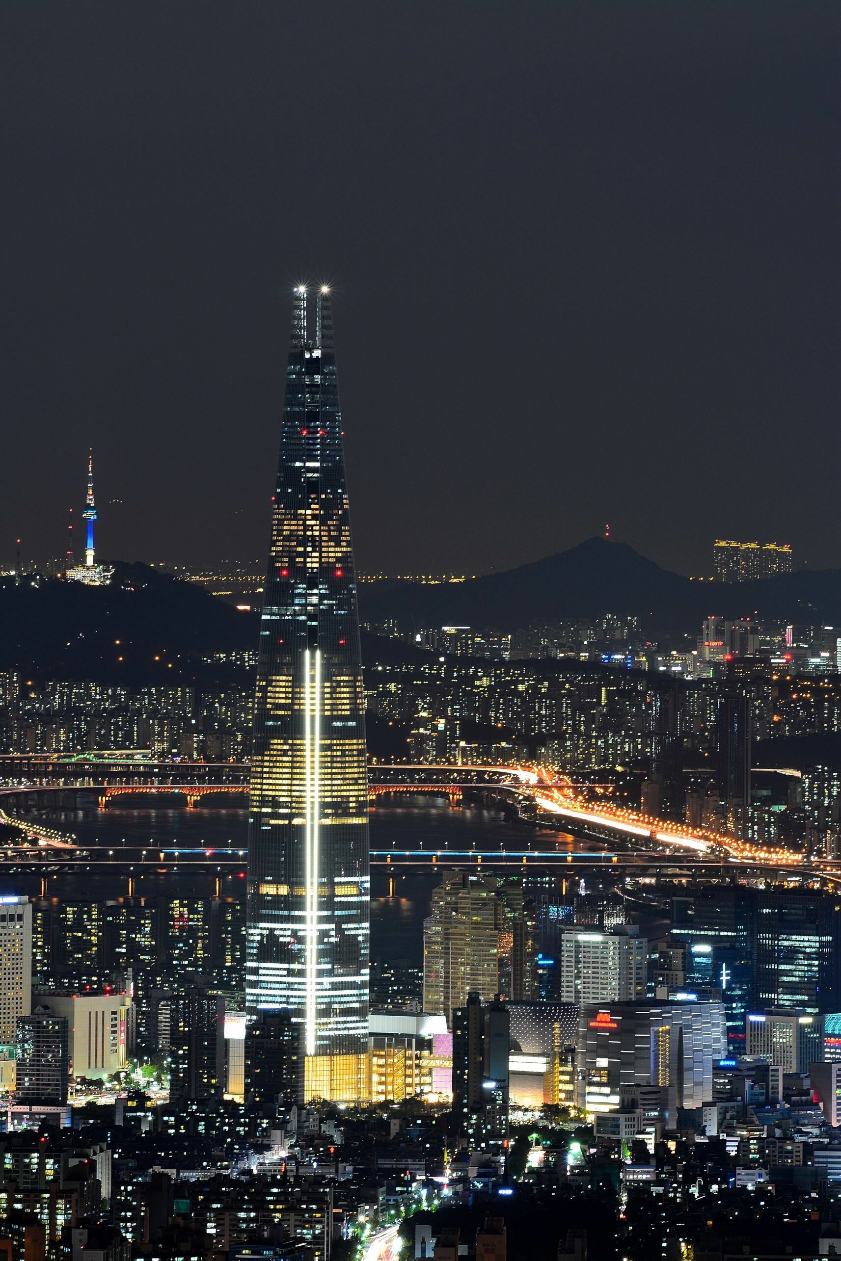 Korea: Night city, The Lotte World Tower, Sincheon-dong, Songpa. 1720x2570 HD Background.