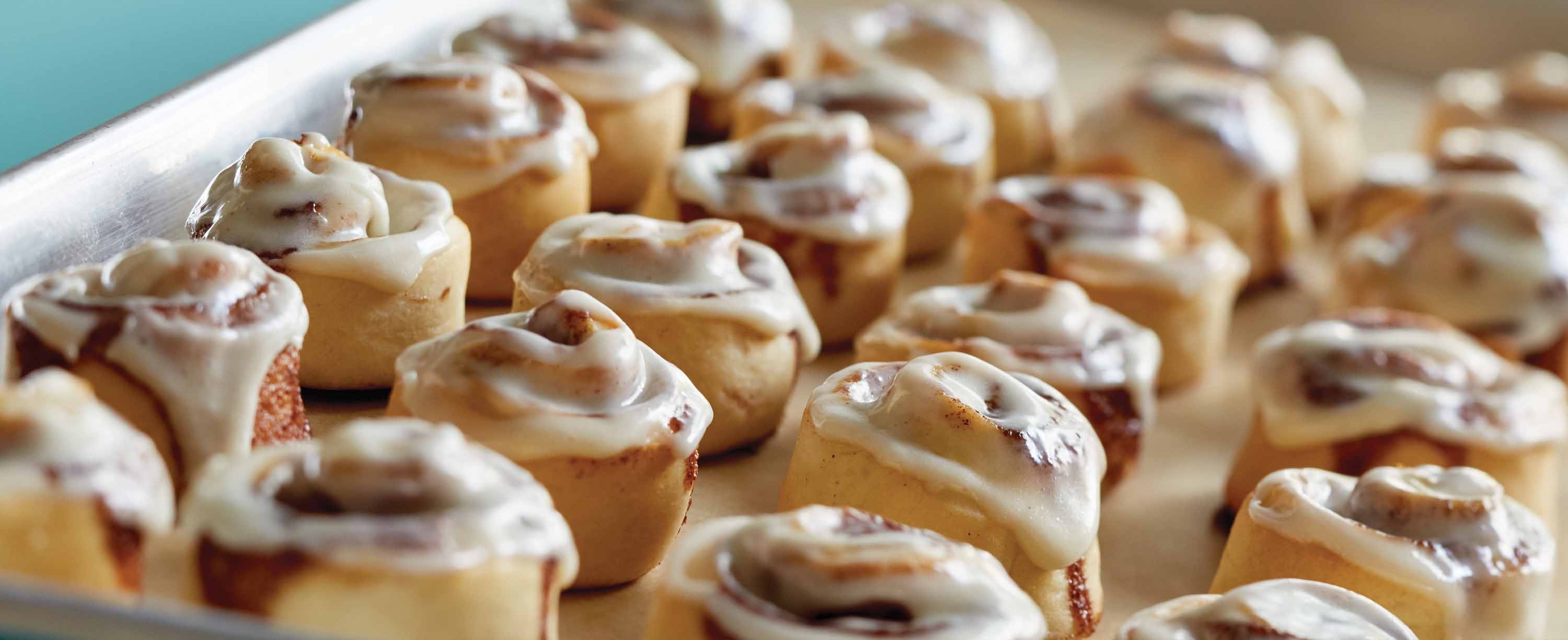 Cinnamon roll: Coiled into square- or round-shaped buns, Pastry. 3000x1230 Dual Screen Background.