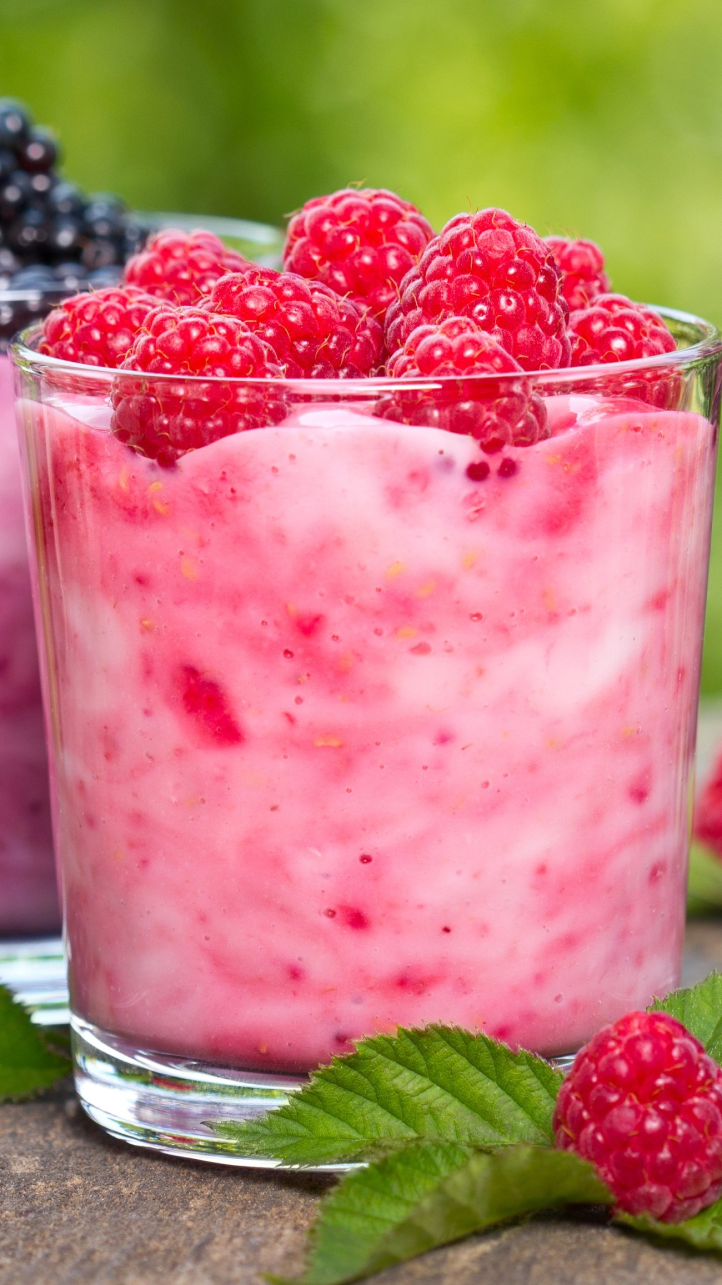 Milkshake: A cold drink topped with raspberries. 1440x2560 HD Background.