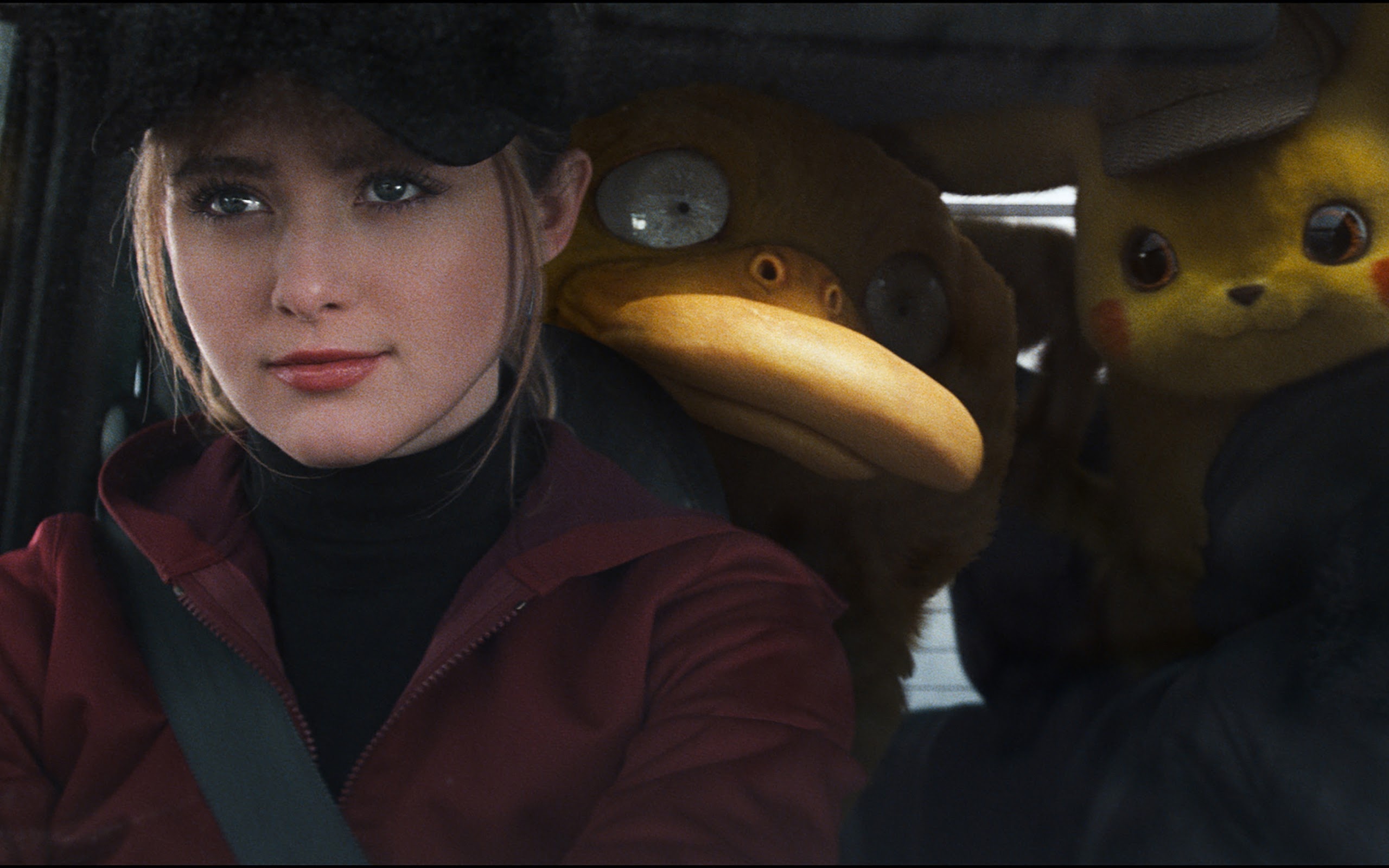 Pokemon Detective Pikachu: Kathryn Newton as Lucy Stevens, a junior reporter who is accompanied by a Psyduck. 2560x1600 HD Wallpaper.