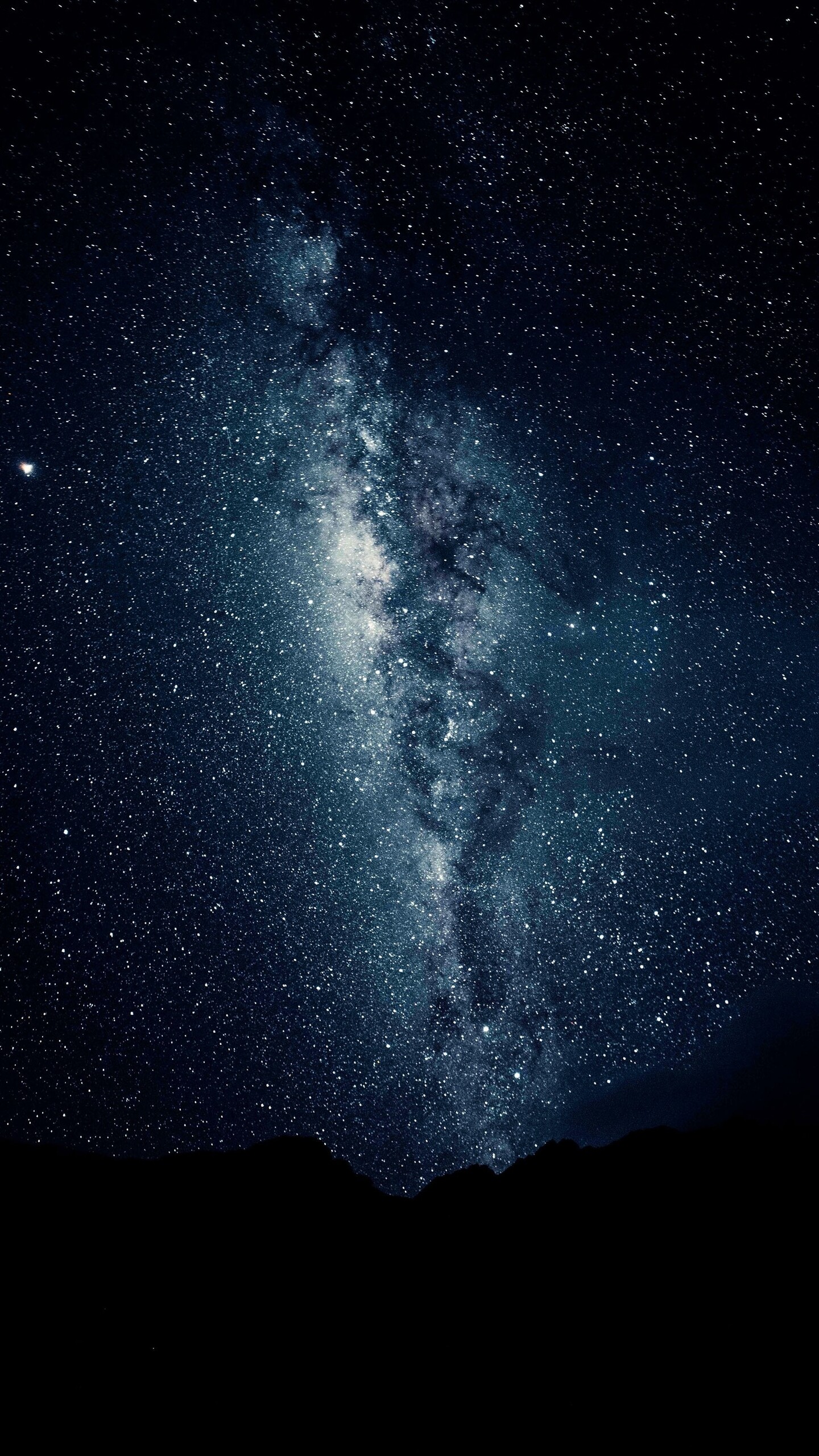 Milky Way: The galaxy moves through space at a velocity of about 343 miles per second. 1440x2560 HD Background.