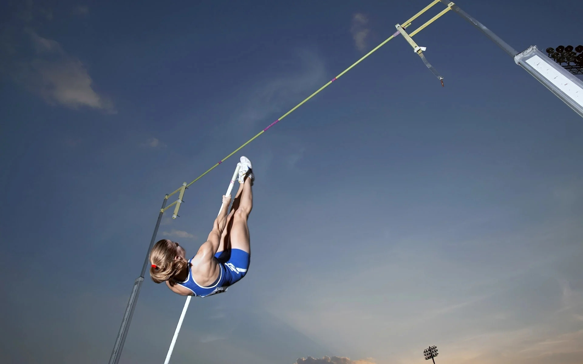 Pole Vaulting: A sport in which competitors try to leap over a bar by using flexible stick. 1920x1200 HD Background.