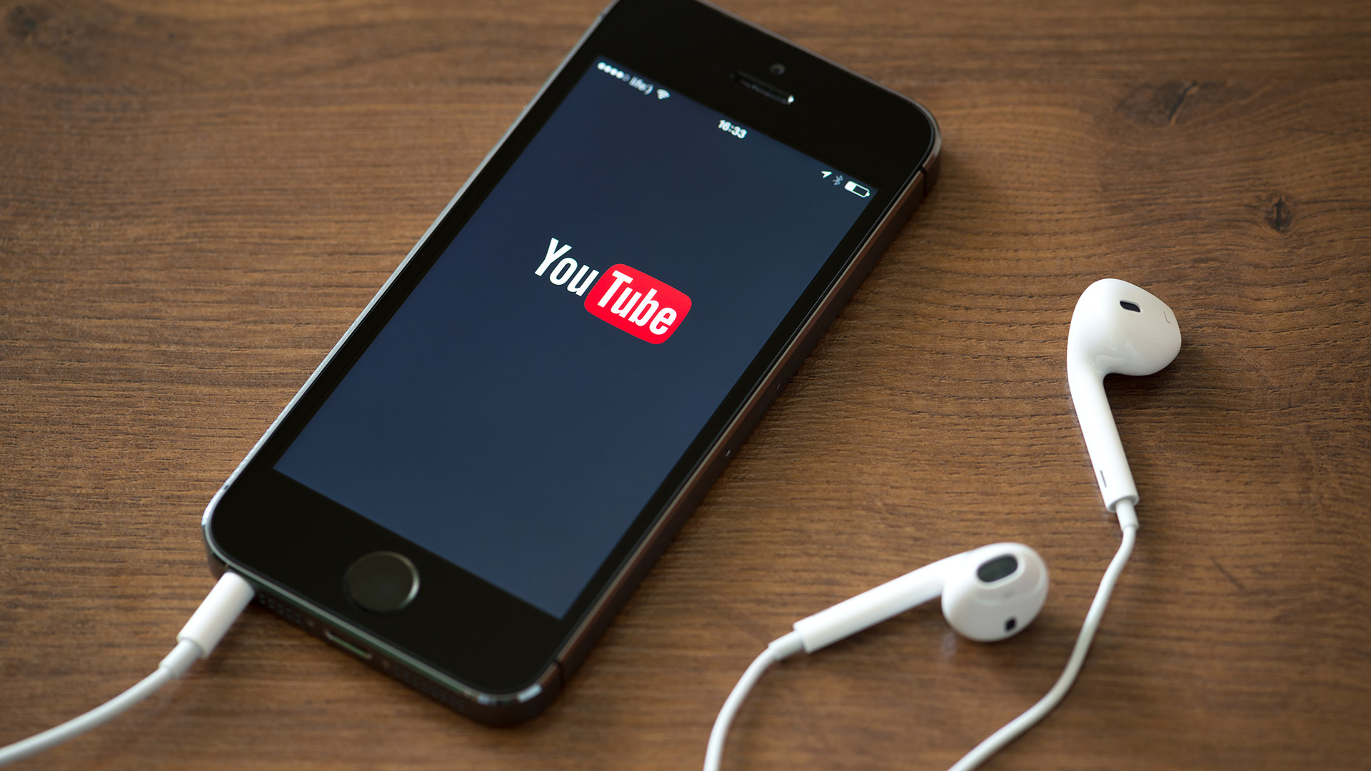 YouTube: A free service for content-sharing, Mobile app. 1920x1080 Full HD Background.