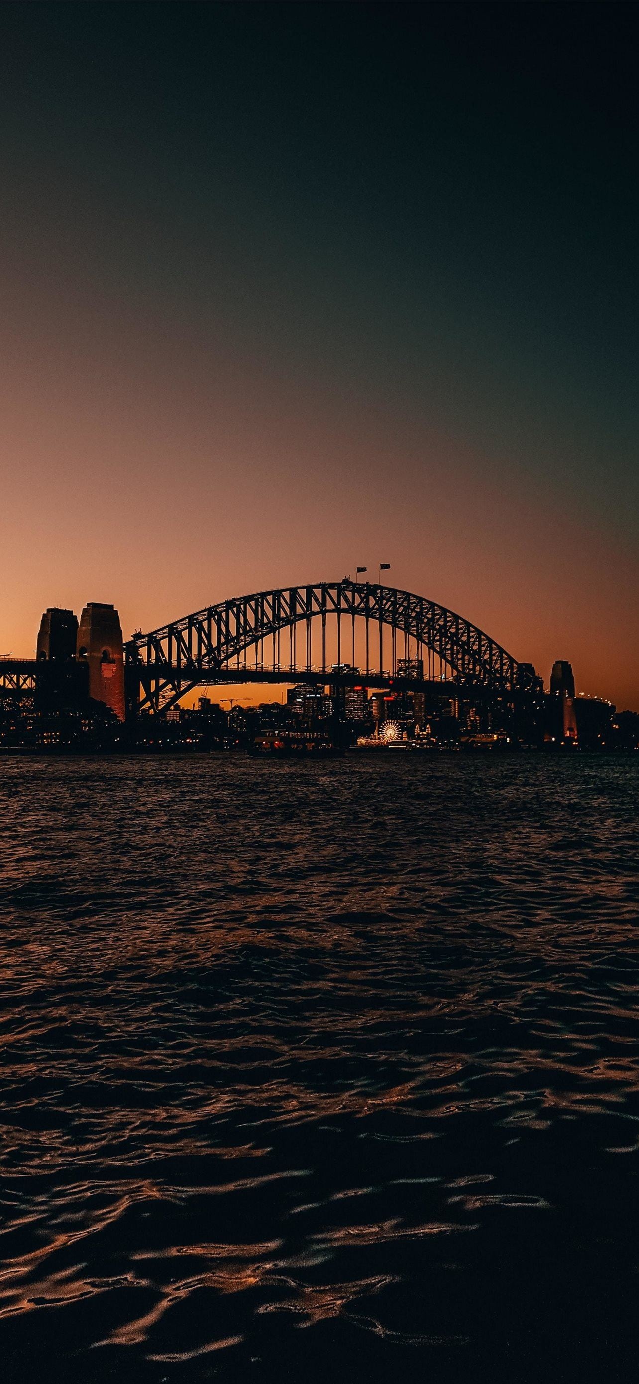 Sydney: Harbour Bridge is the world’s largest steel arch bridge. 1290x2780 HD Background.