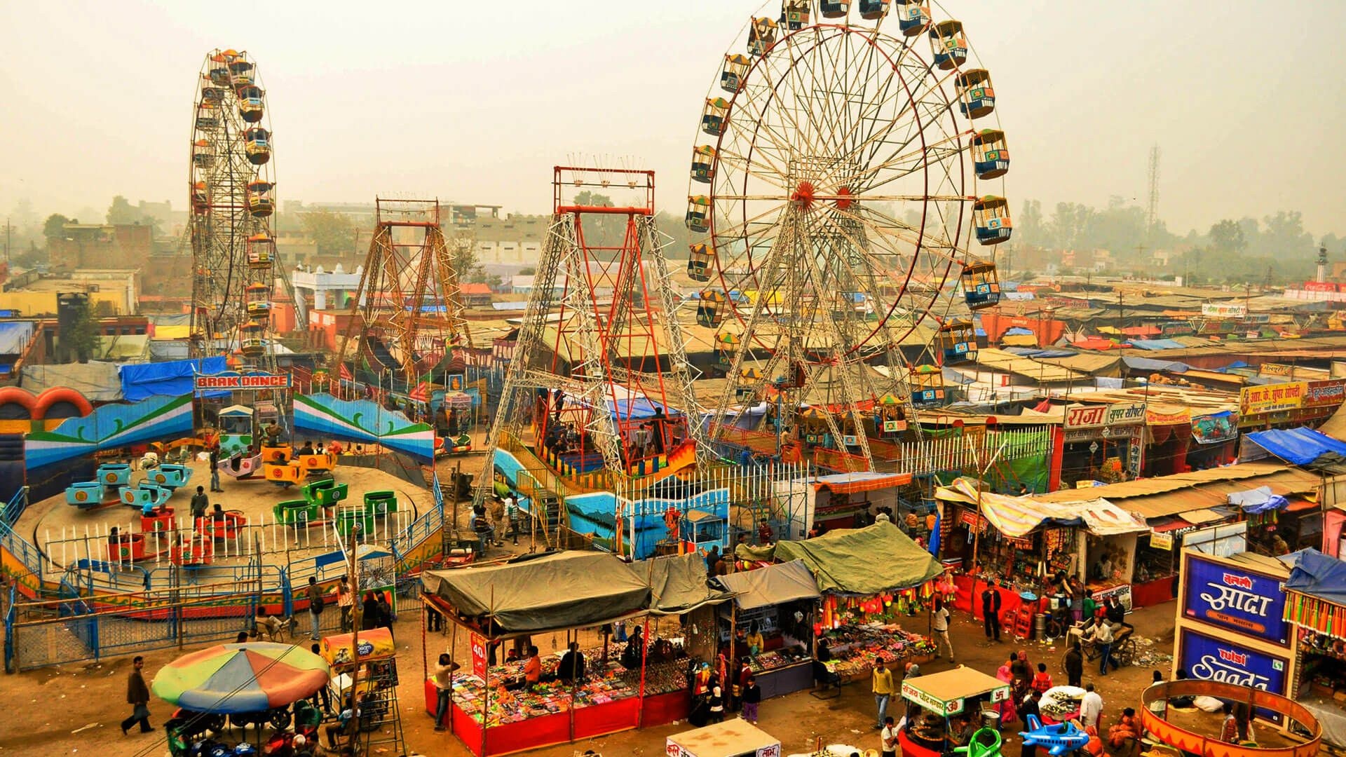 Fun Fair: Tarnetar Festival in Gujarat, Cultural festival, An open-air entertainment area. 1920x1080 Full HD Background.